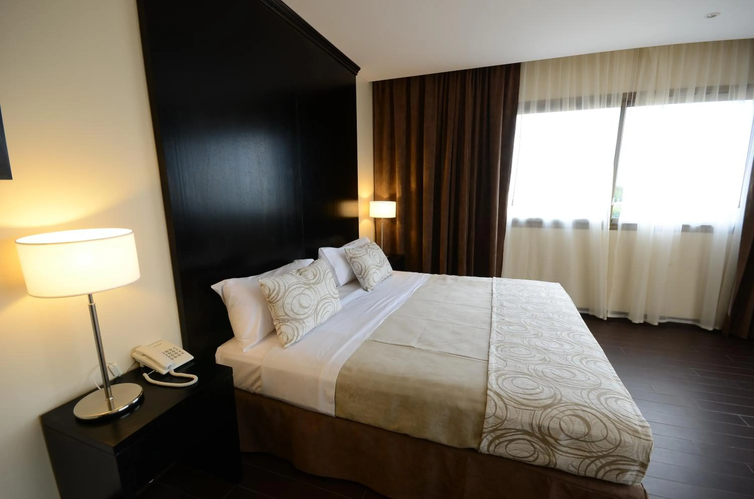 Bed in Grand Crucero Hotel