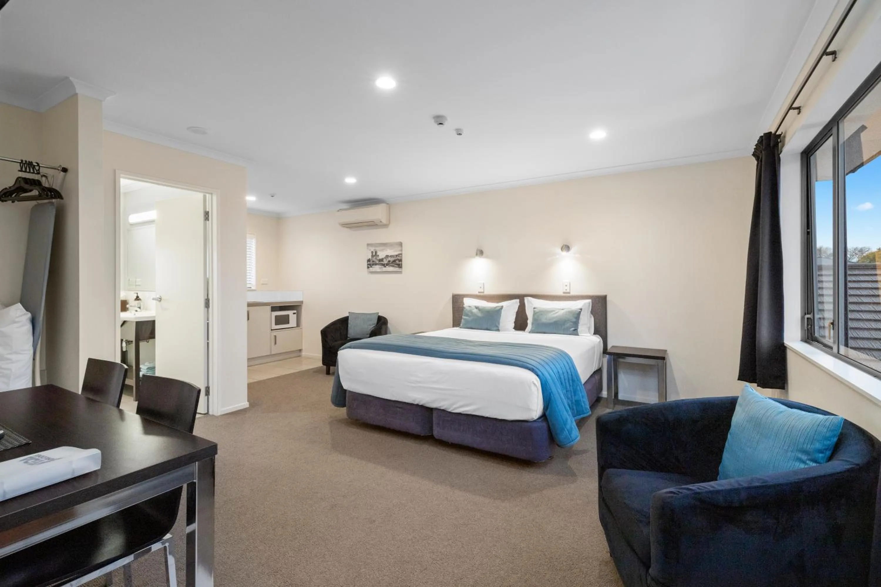 Bed in ASURE Aveda Motor Lodge