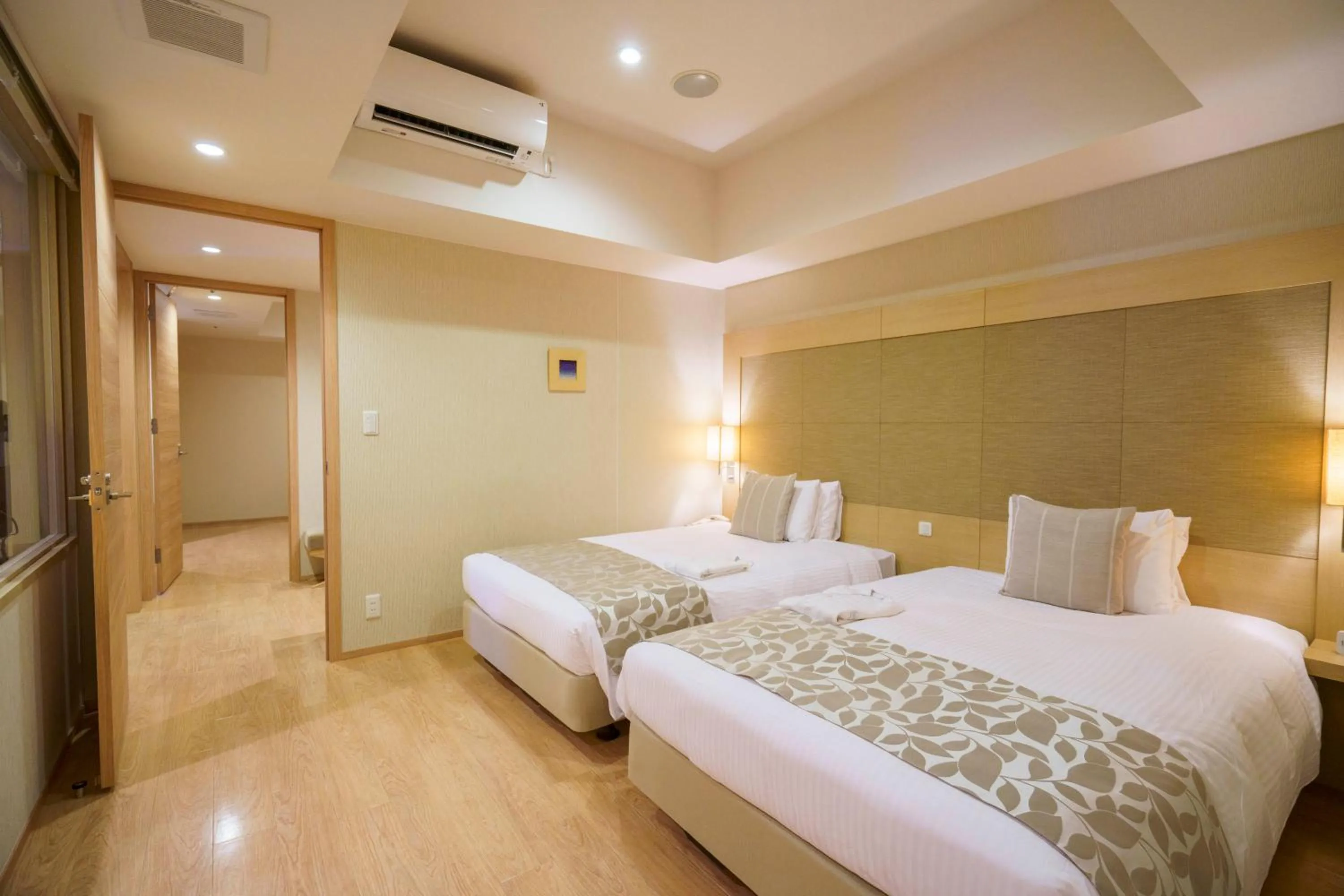 Bed in Moon Ocean Ginowan Hotel & Residence