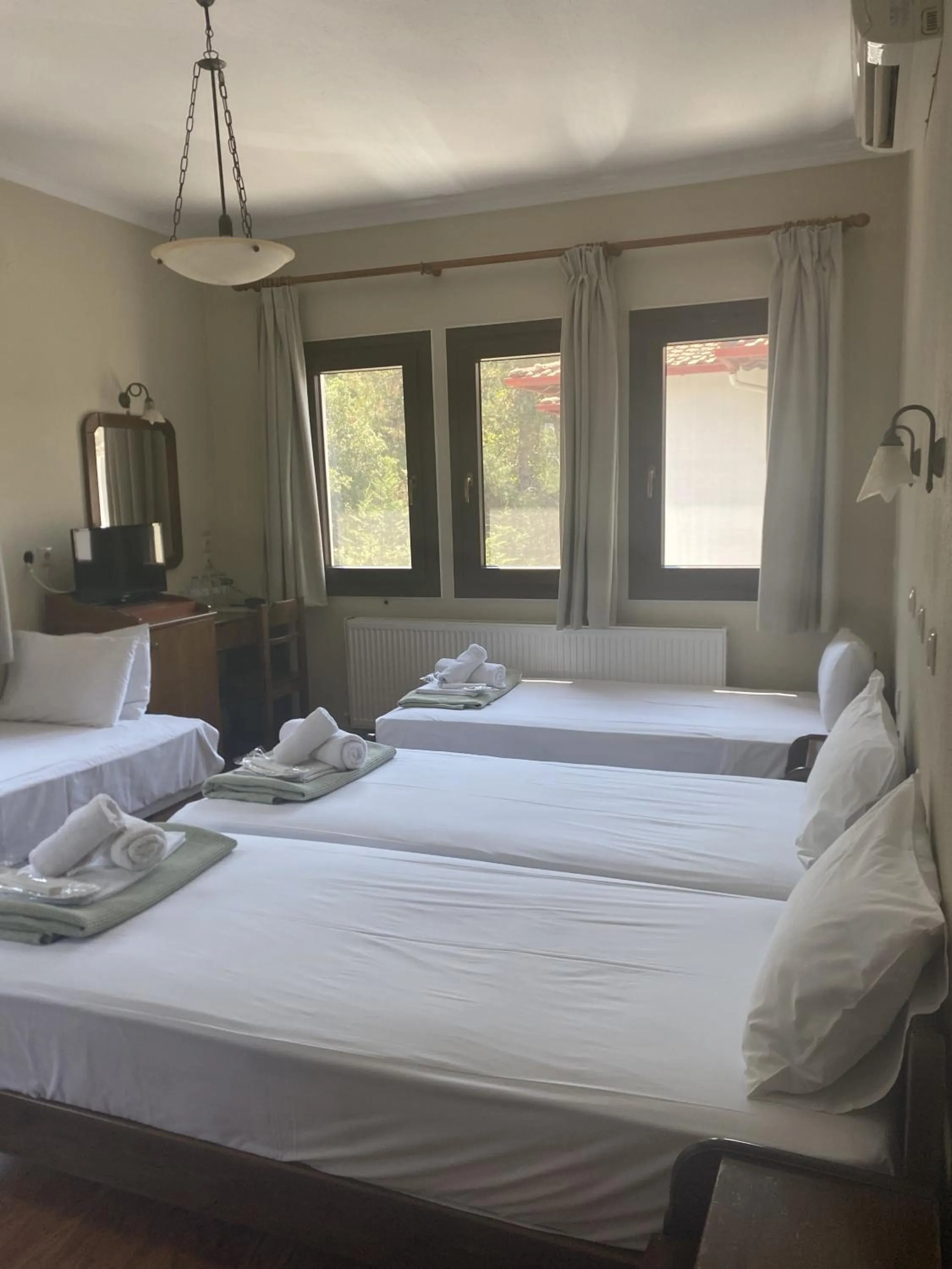 Bed in Agnanti Hotel