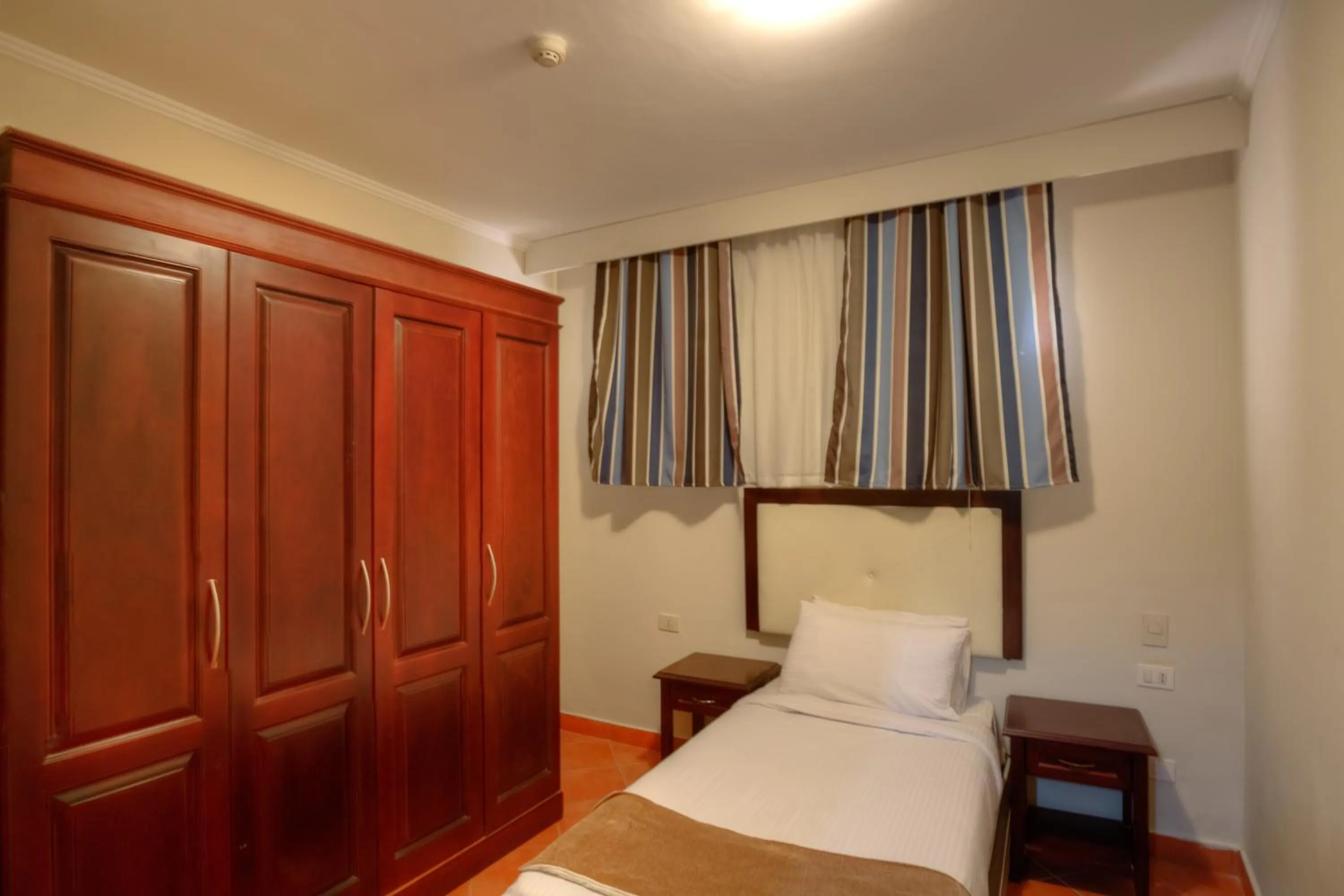 Bed in Porto Marina Apartments powered By Amer-Group