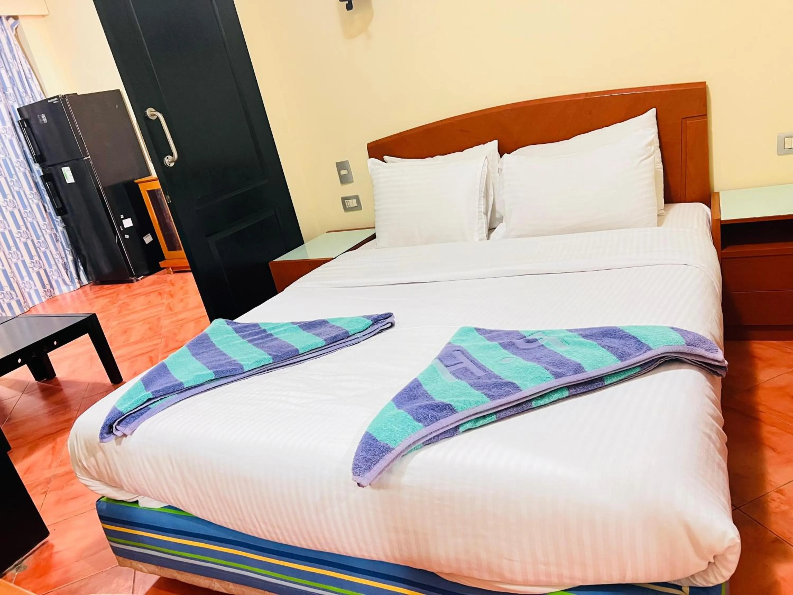 Bed in Porto Marina Apartments powered By Amer-Group