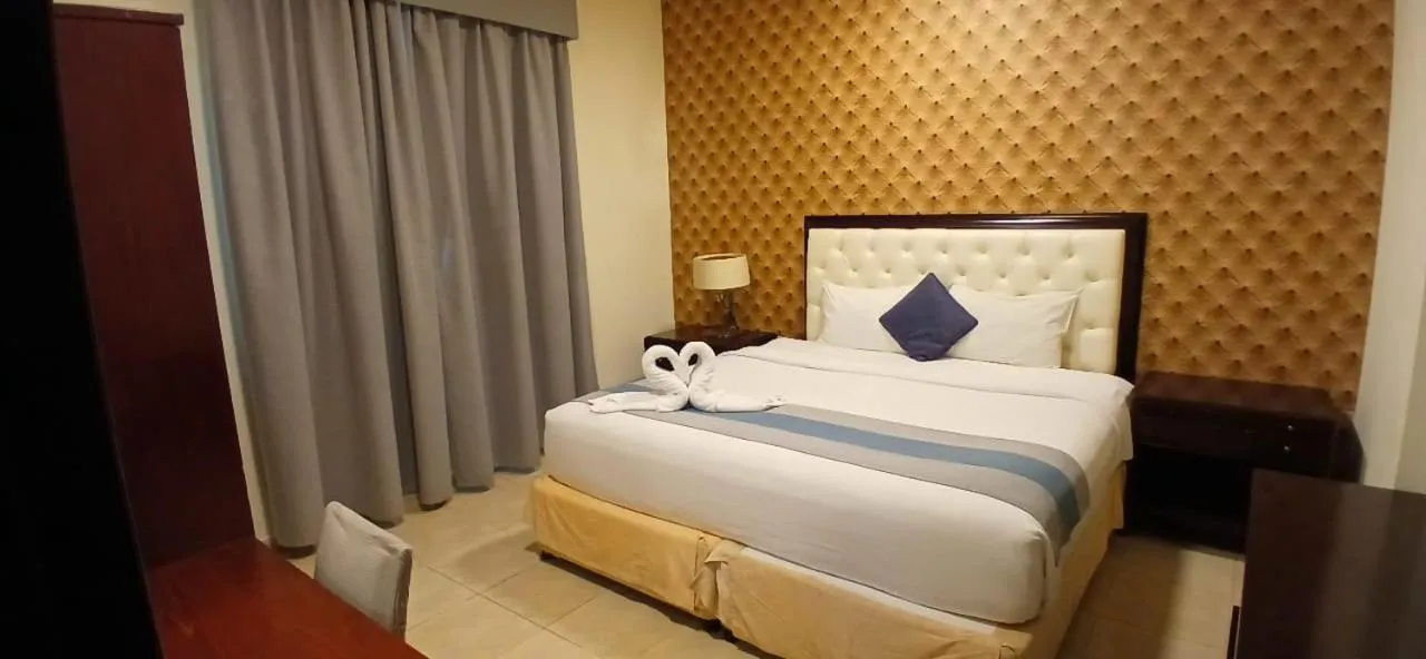 Bed in Mermaid Beach Hotel LLC