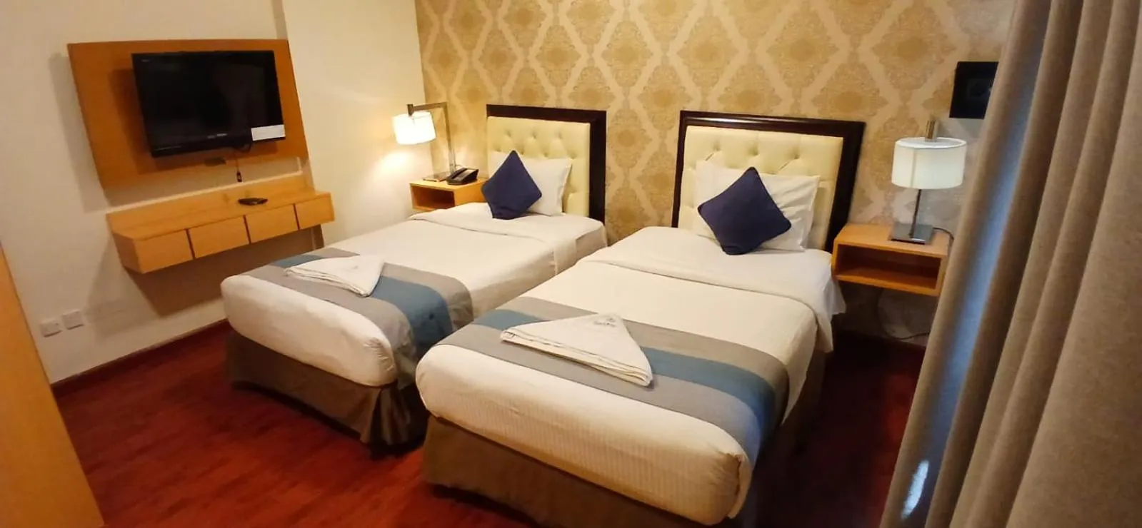 Bed in Mermaid Beach Hotel LLC