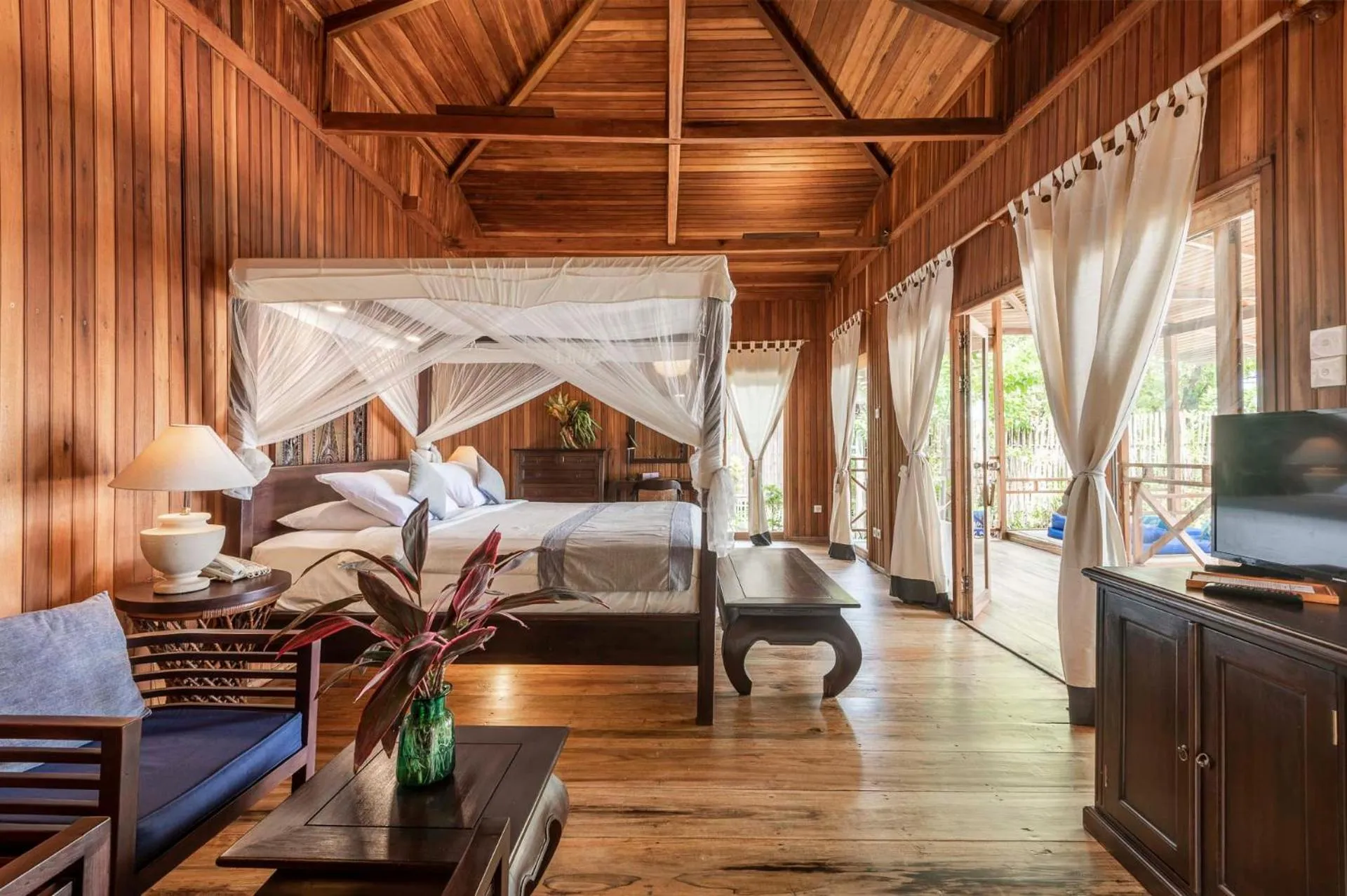 Seating area, Bed in Siladen Resort & Spa