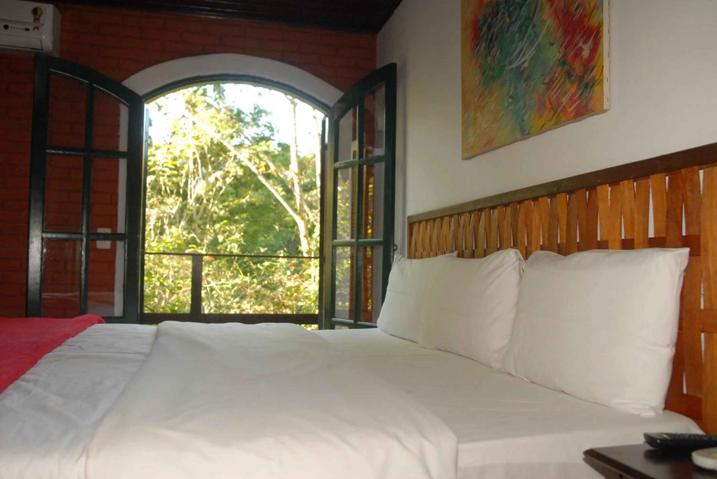 Bed in Pousada Mirante do Penedo