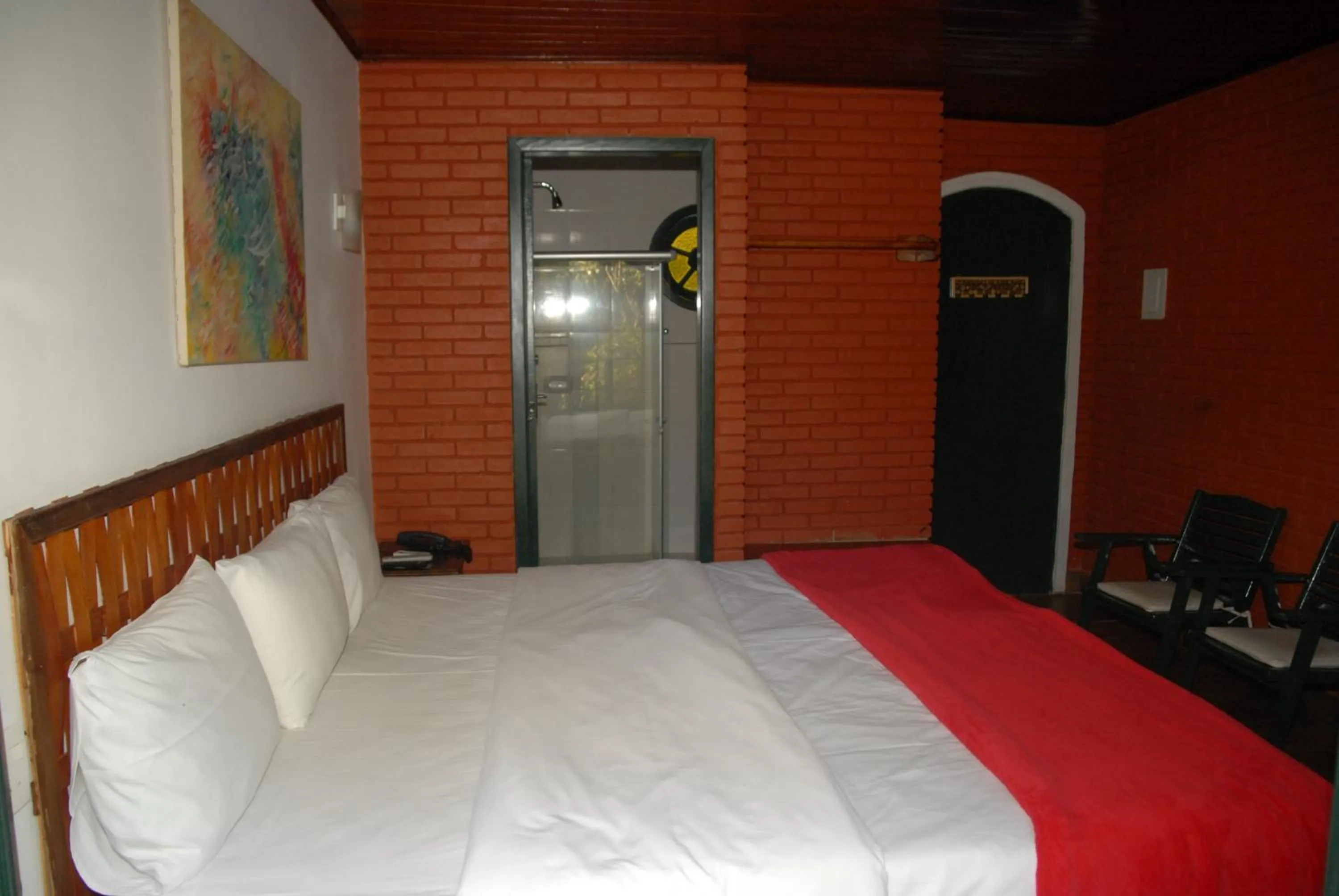 Bed in Pousada Mirante do Penedo