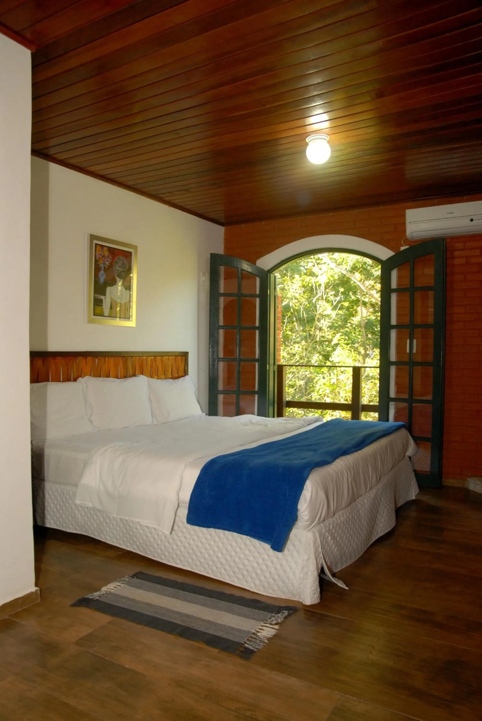 Bed in Pousada Mirante do Penedo