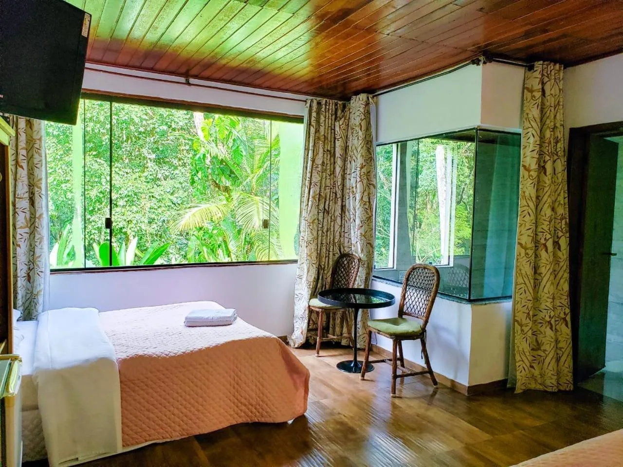 Bed in Pousada Mirante do Penedo