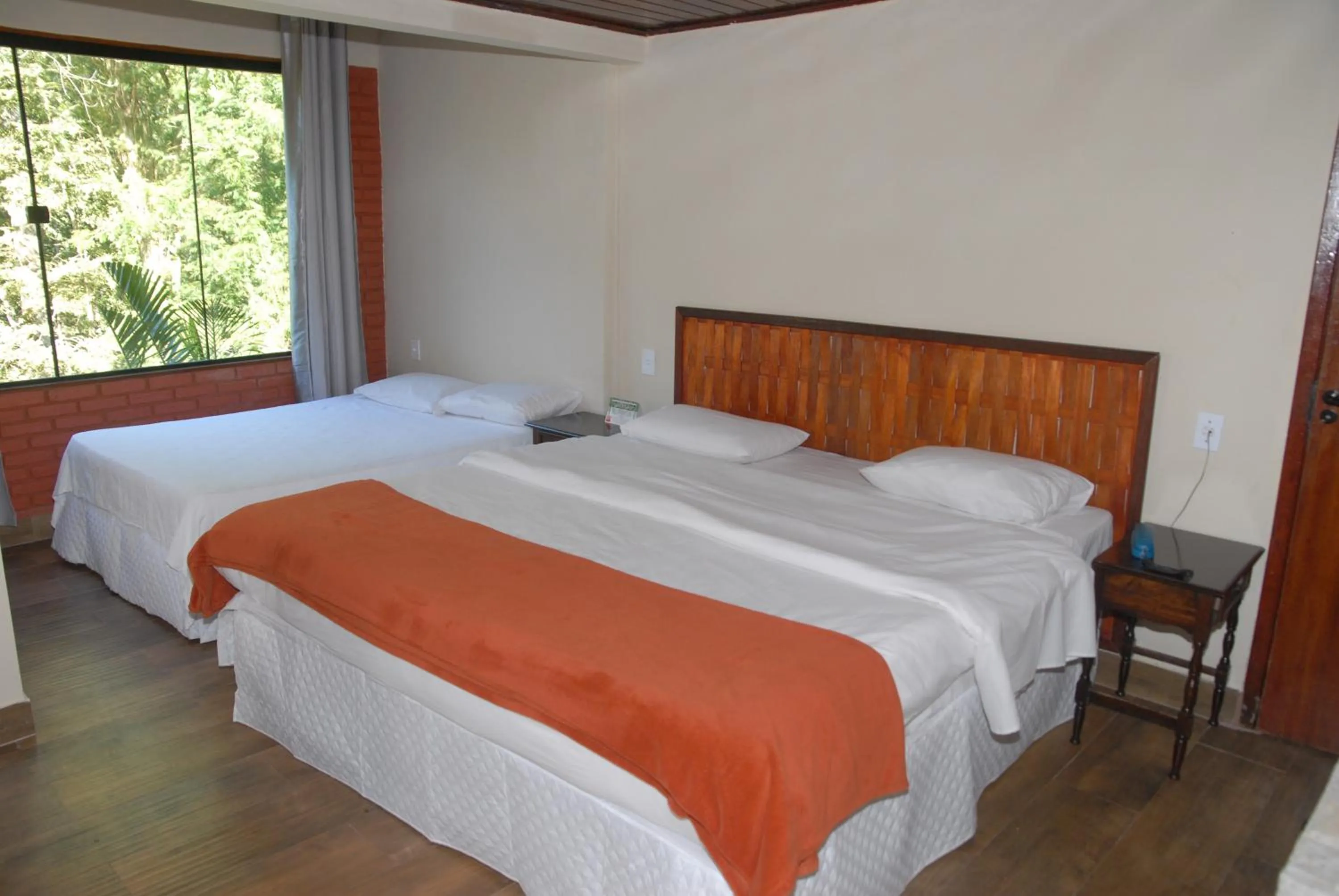 Bed in Pousada Mirante do Penedo