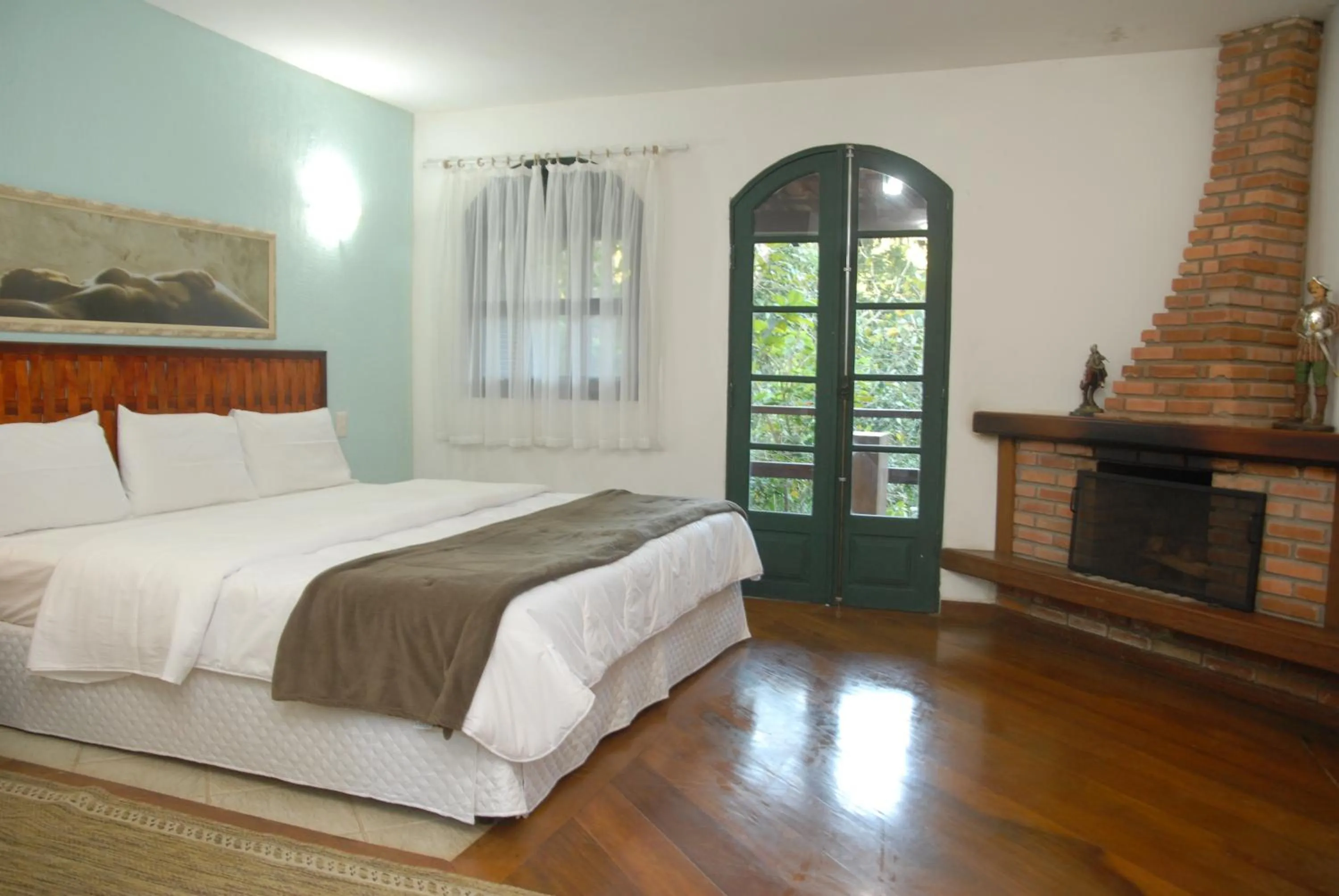 Bed in Pousada Mirante do Penedo