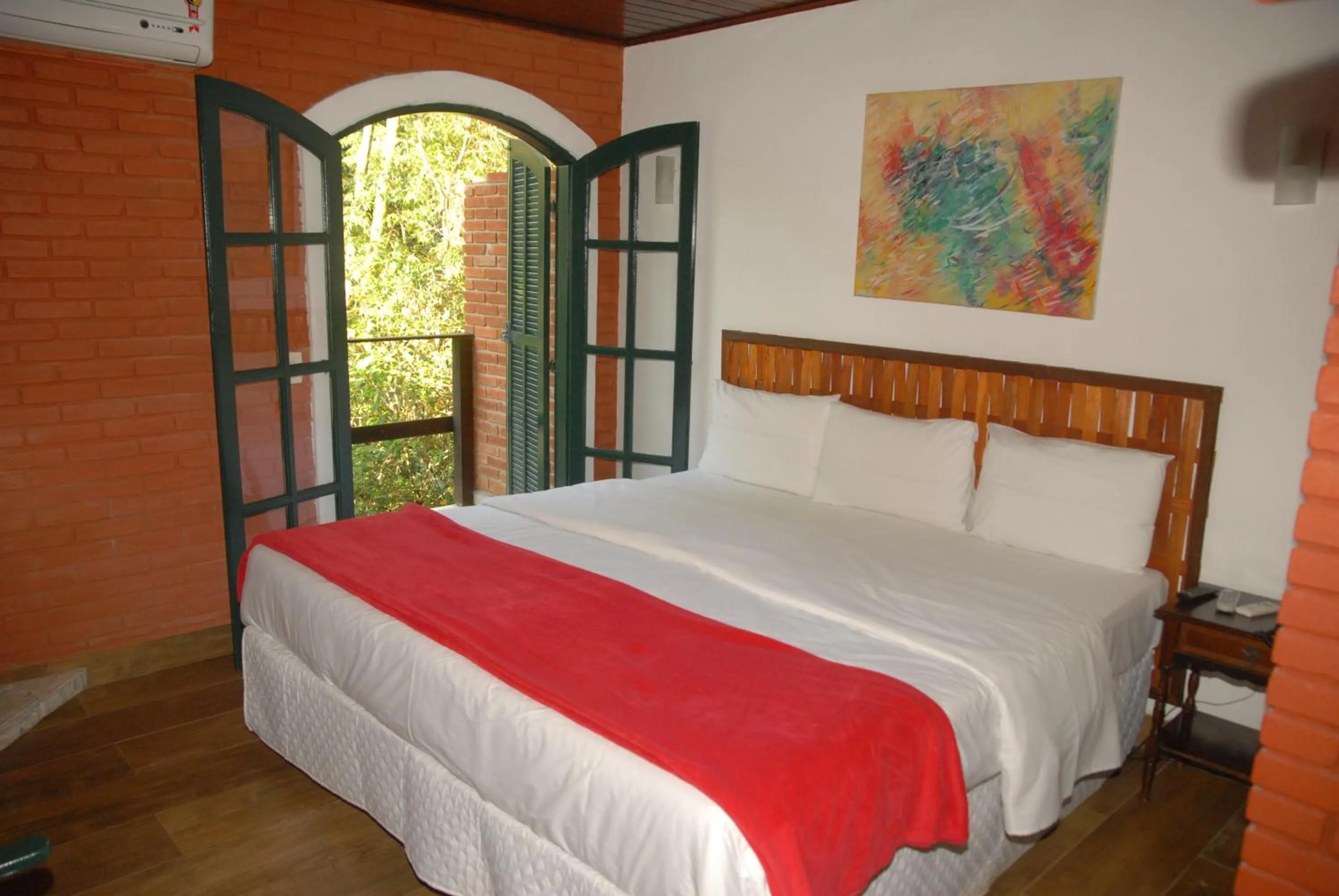 Bed in Pousada Mirante do Penedo