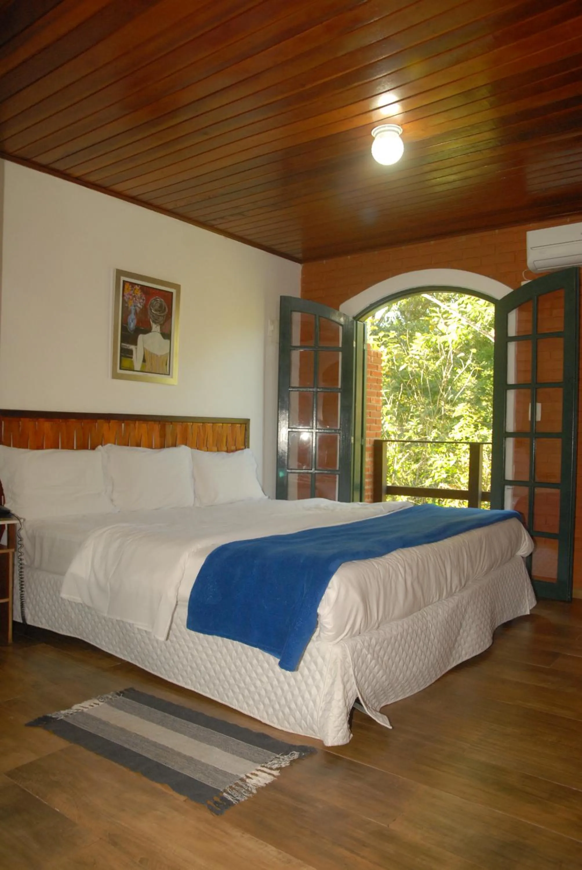 Photo of the whole room, Bed in Pousada Mirante do Penedo