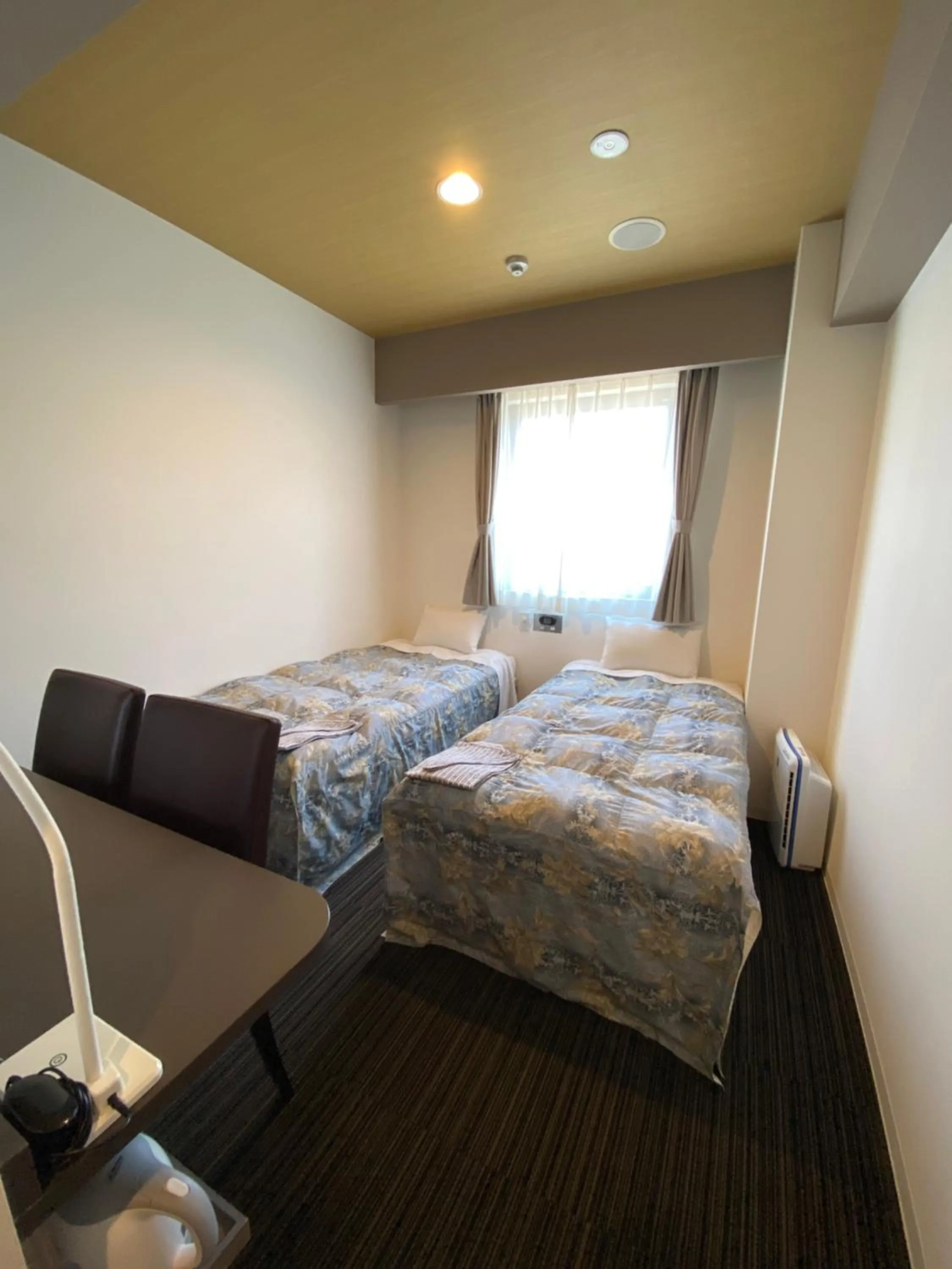 Bed in Murayama Nishiguchi Hotel