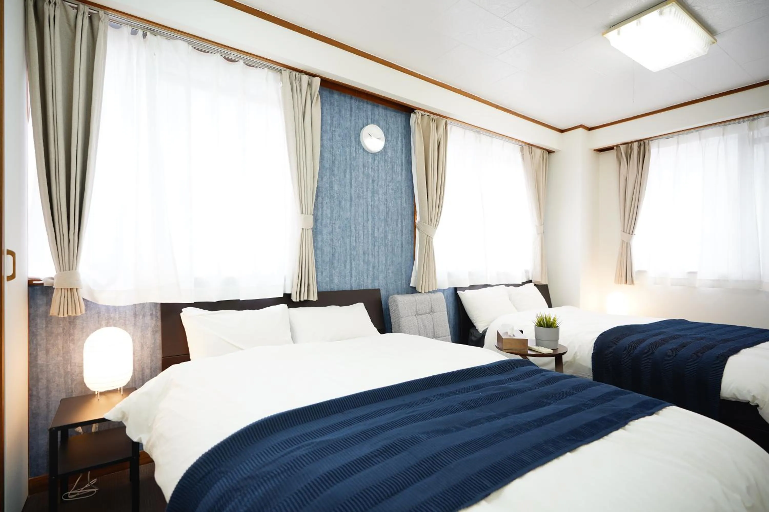 Bed in Naha Southerlies Condominium Kumoji