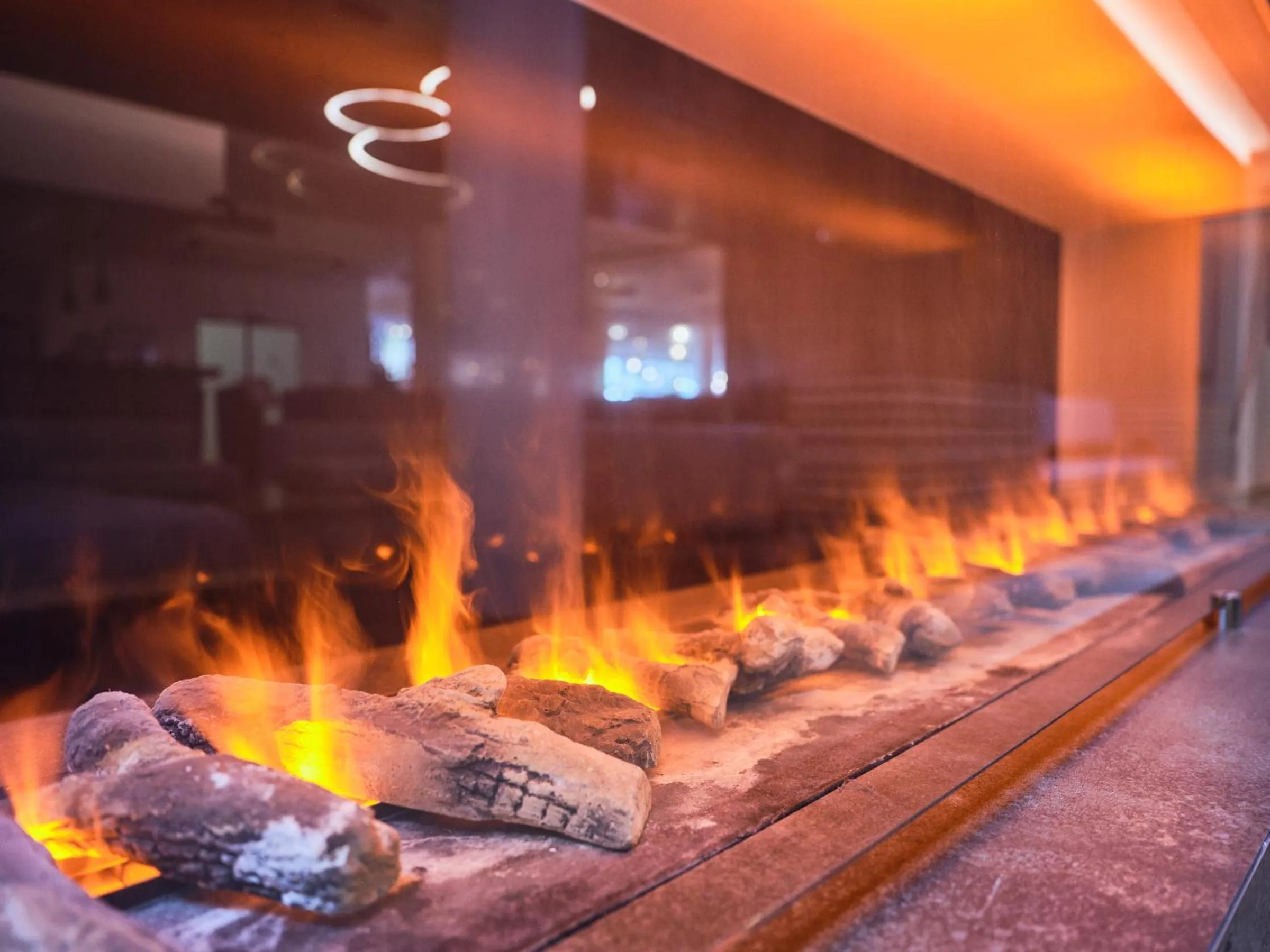 Communal lounge/ TV room in Hotel Planai by Alpeffect Hotels