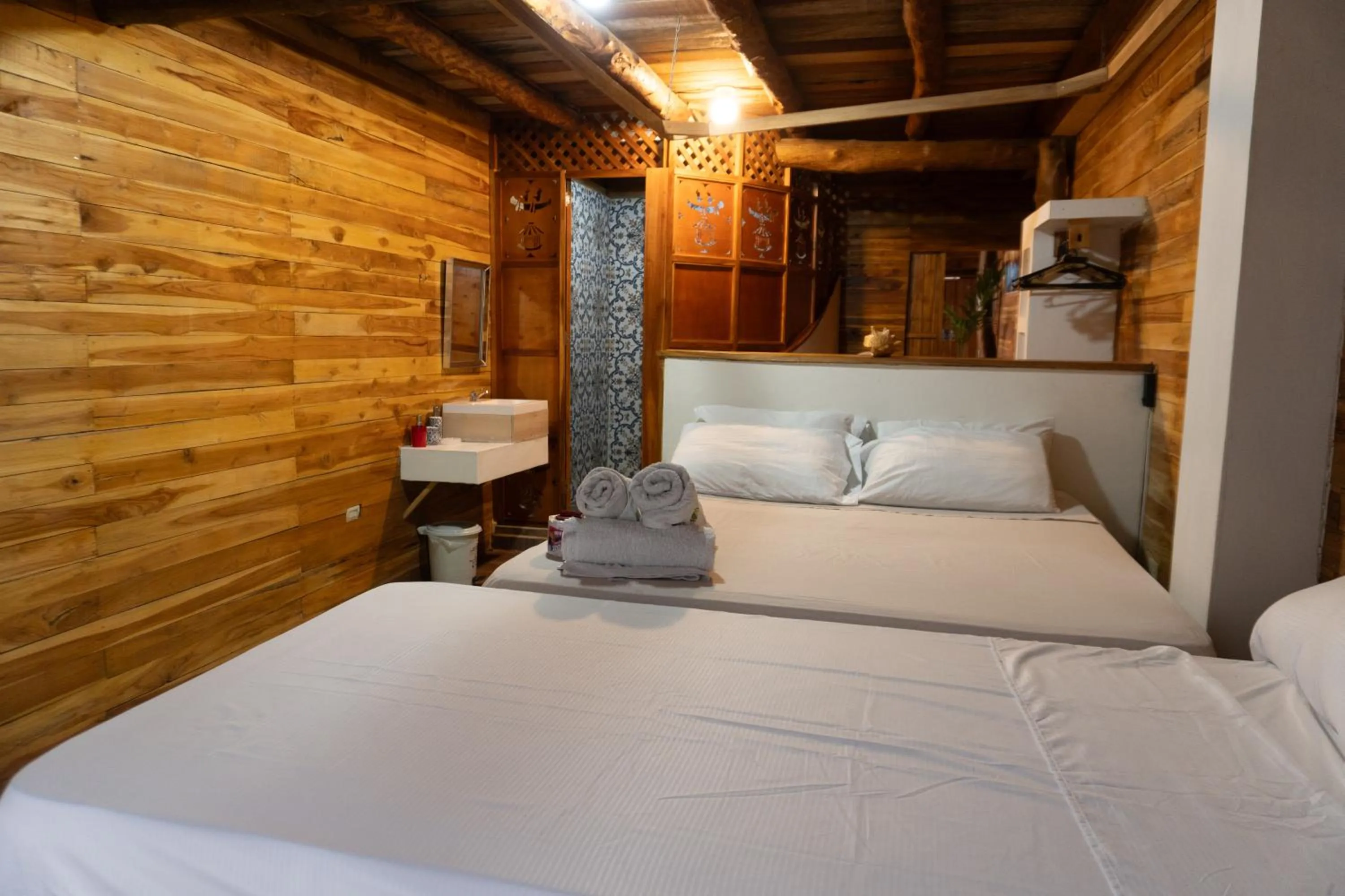 Photo of the whole room, Bed in Hotel Calamari Baru