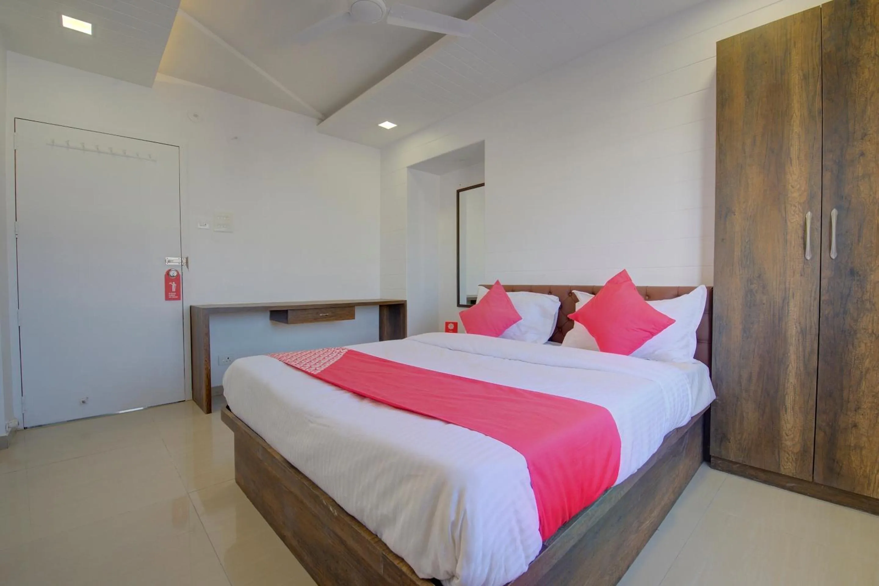 Bedroom in Hotel O RK's Regency Near Navale Hospital Back Gate