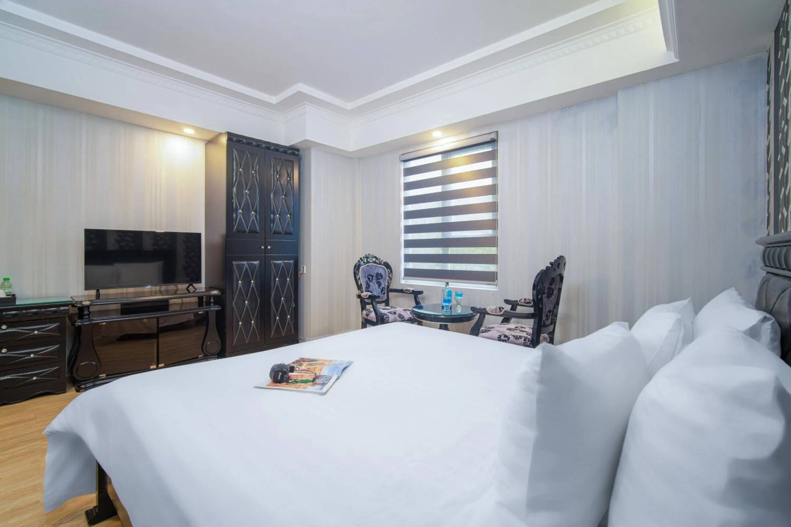 Communal lounge/ TV room, Bed in Royal Beach Hotel by THG