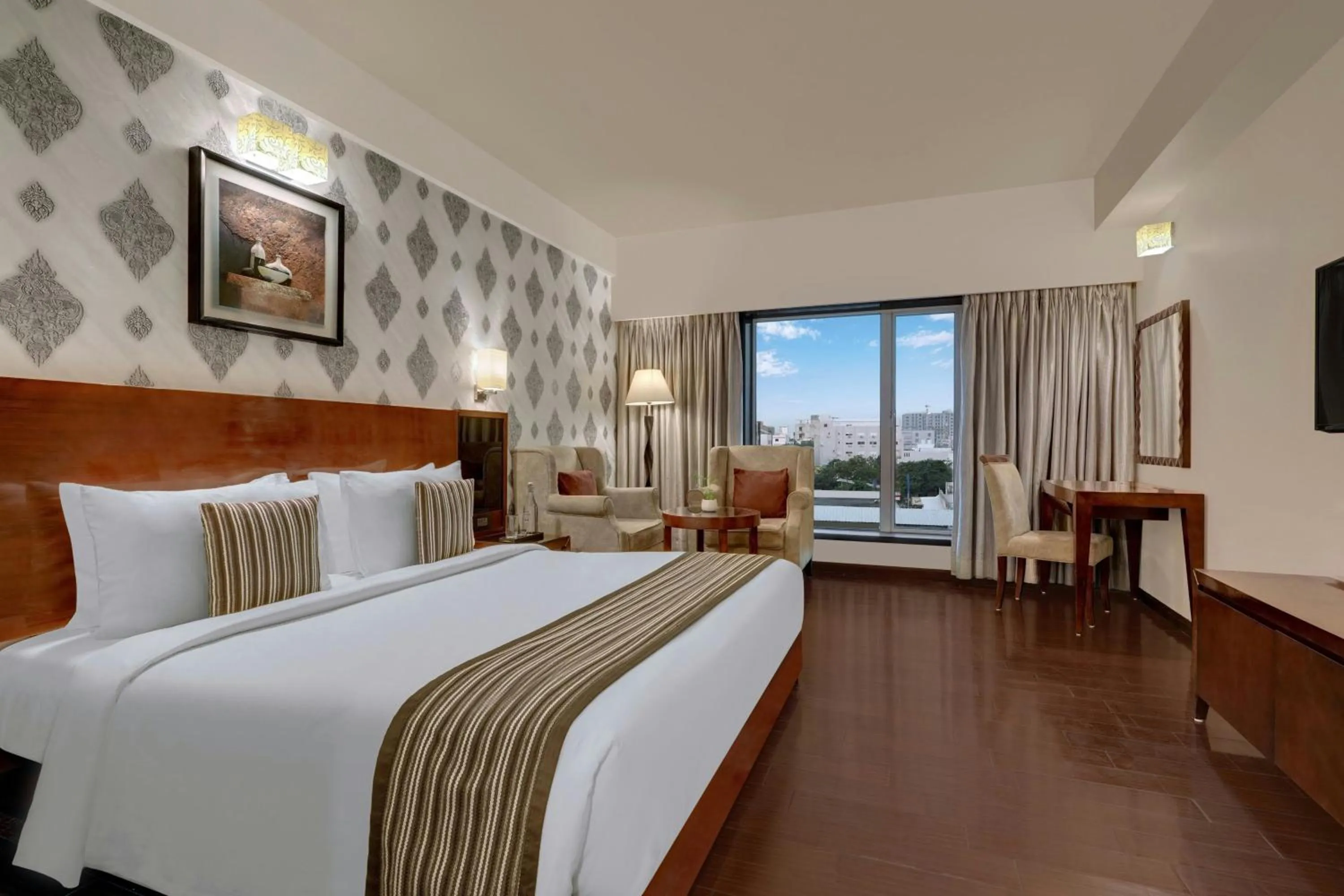 Photo of the whole room, Bed in The Fern Residency Rajkot, Series by Marriott