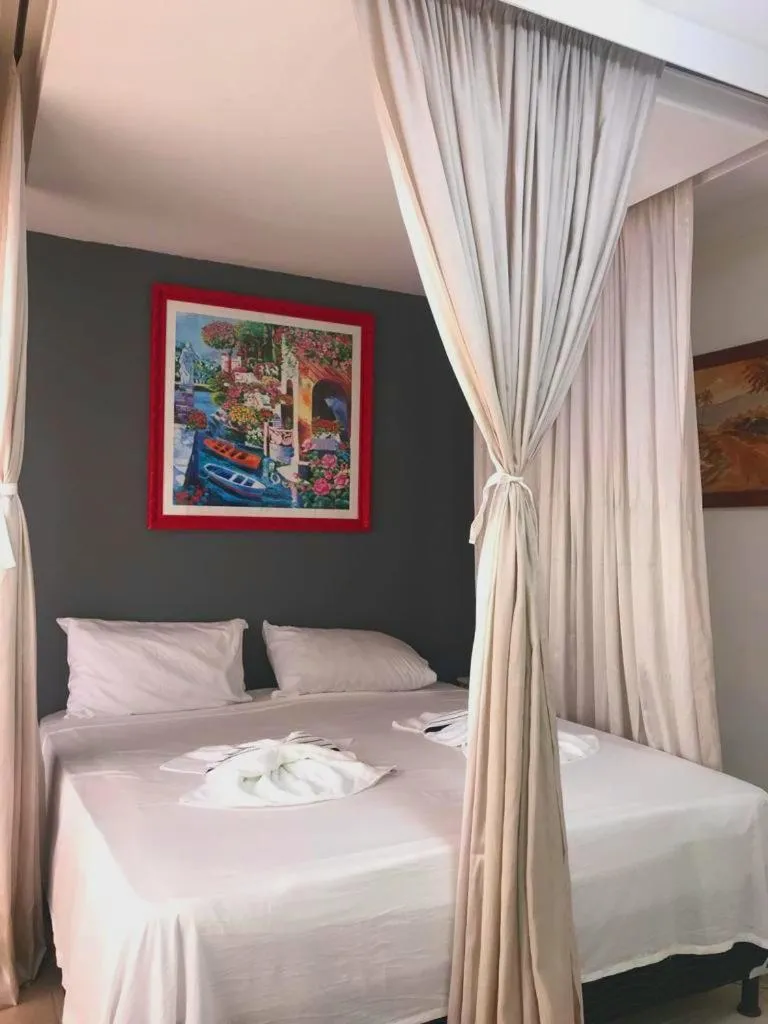 Bed in Relais de Charme Boutique Hotel Pititinga