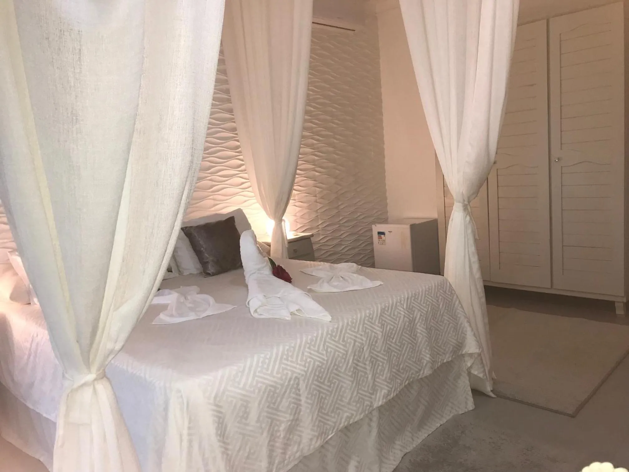 Bed in Relais de Charme Boutique Hotel Pititinga