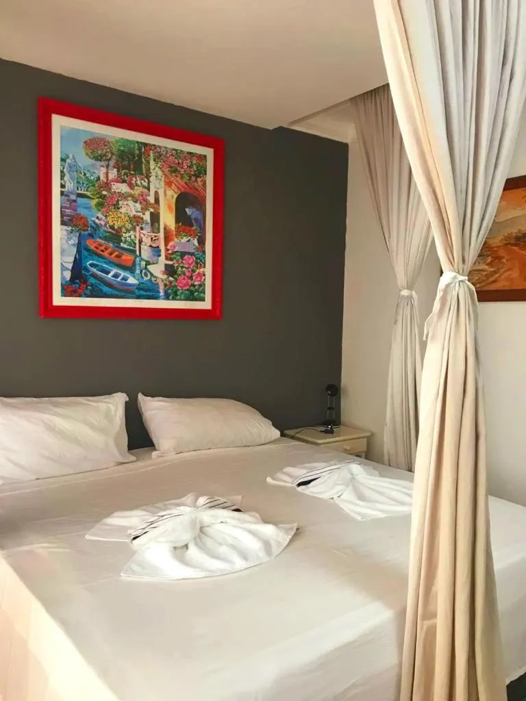 Bed in Relais de Charme Boutique Hotel Pititinga