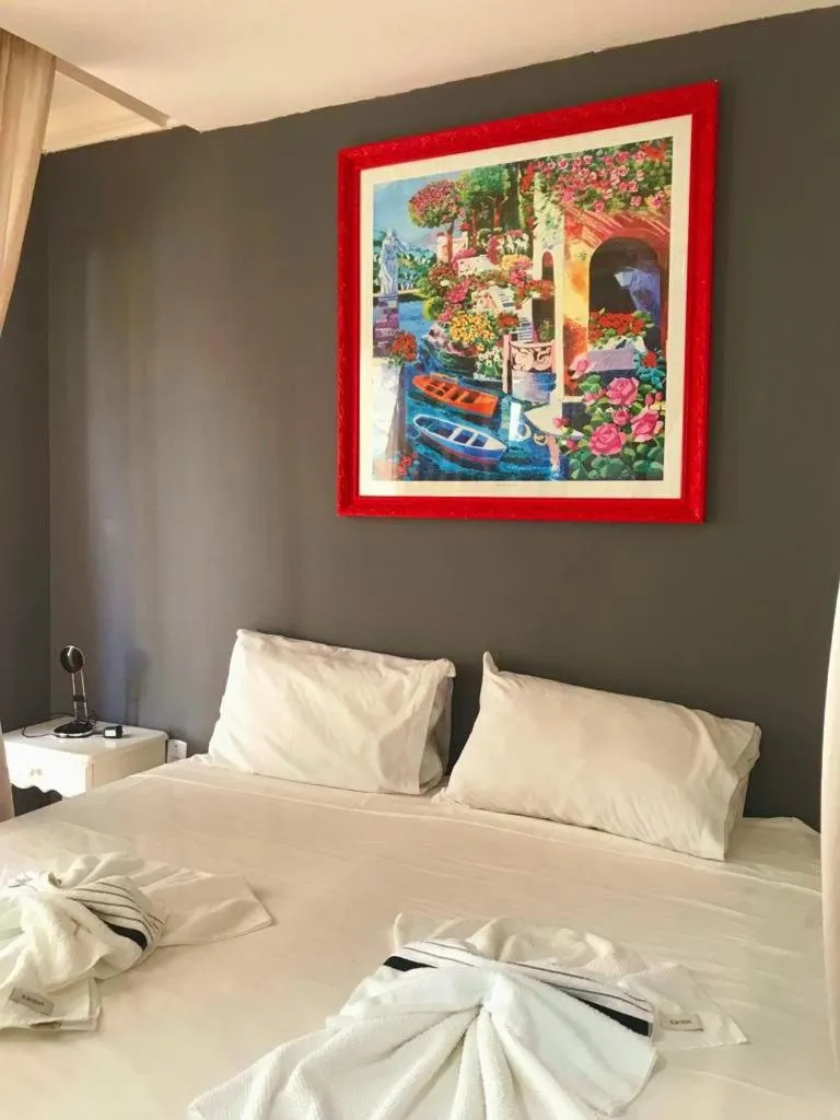 Bed in Relais de Charme Boutique Hotel Pititinga