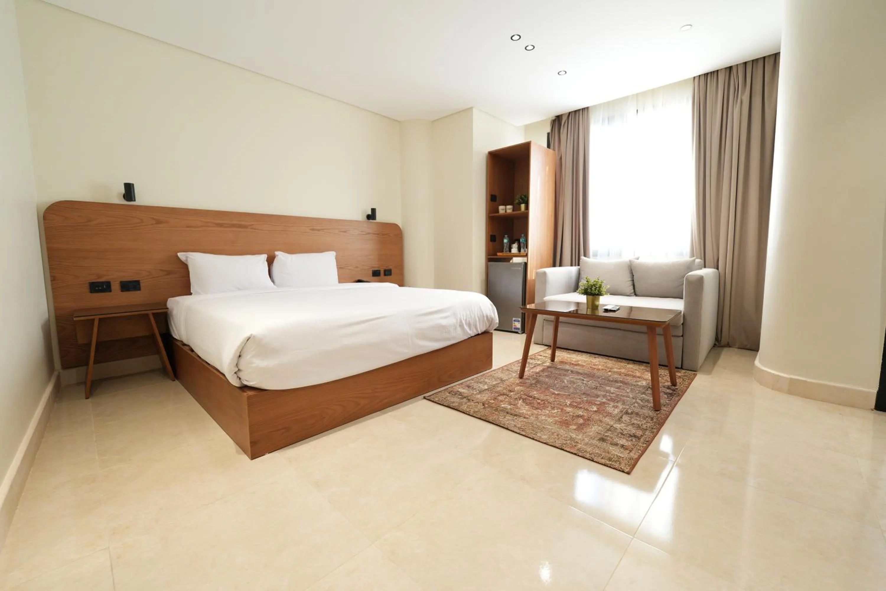 Bed in NewCity Hotel & Suites