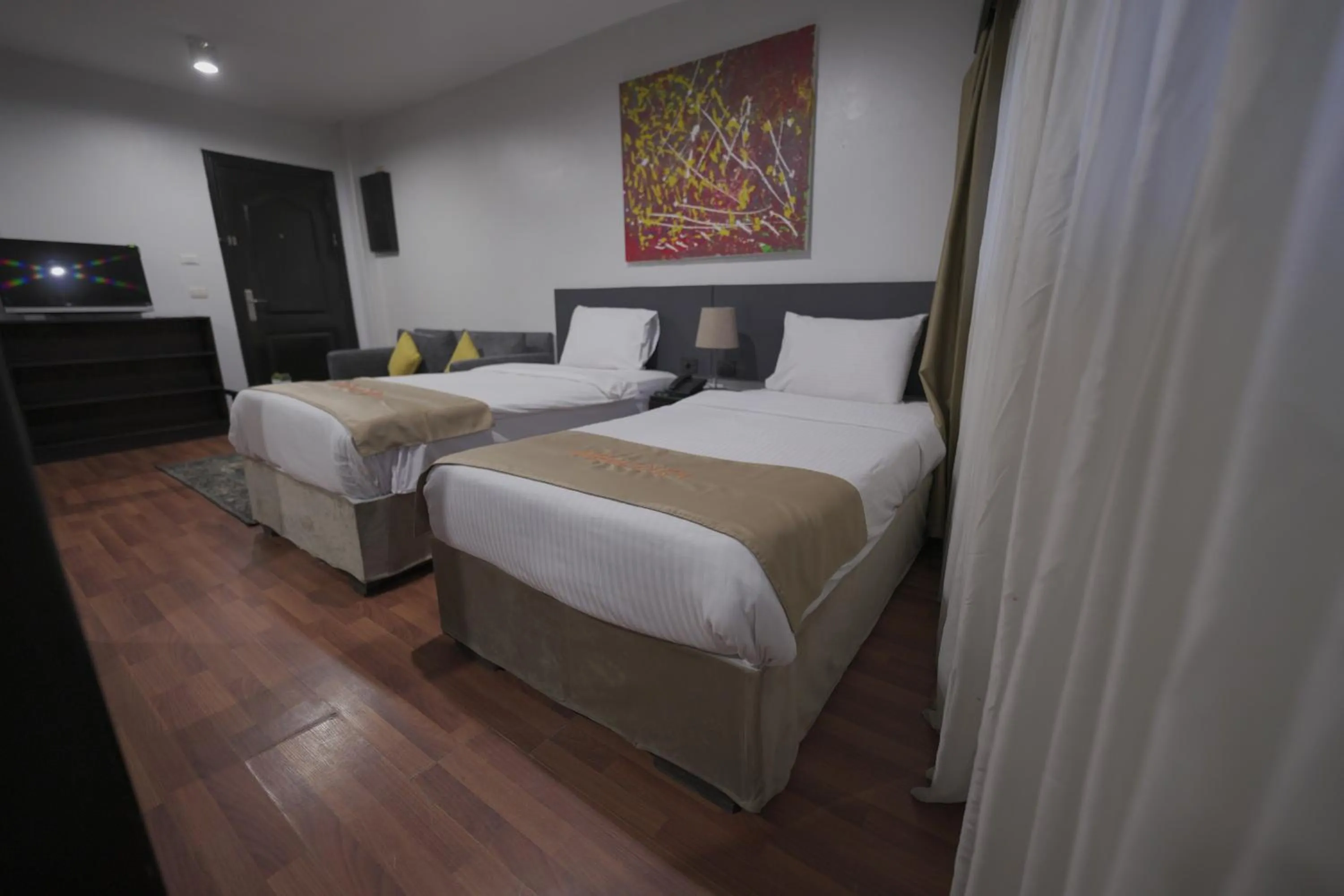 Bed in NewCity Hotel & Suites