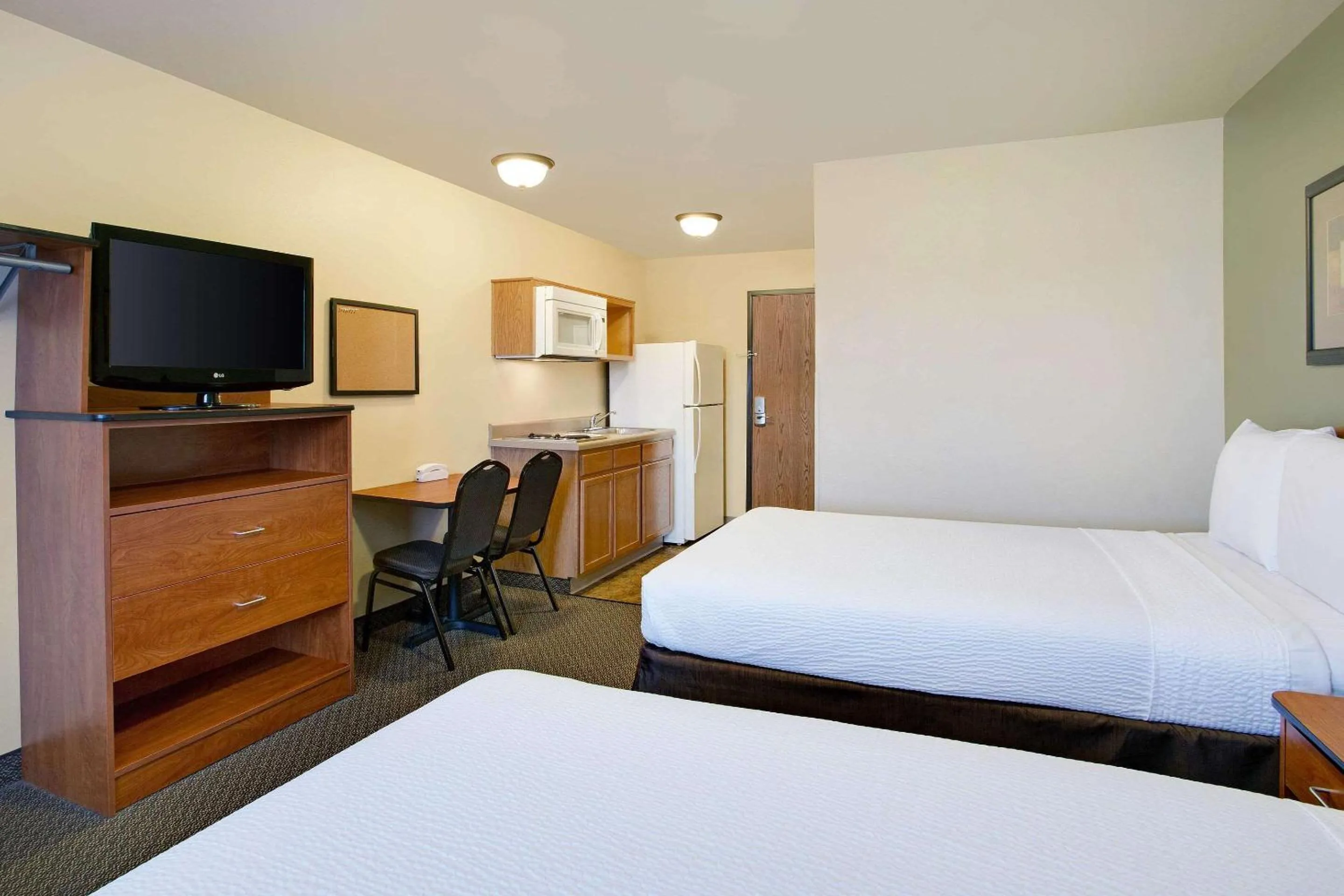 Photo of the whole room, Bed in WoodSpring Suites Raleigh Northeast Wake Forest