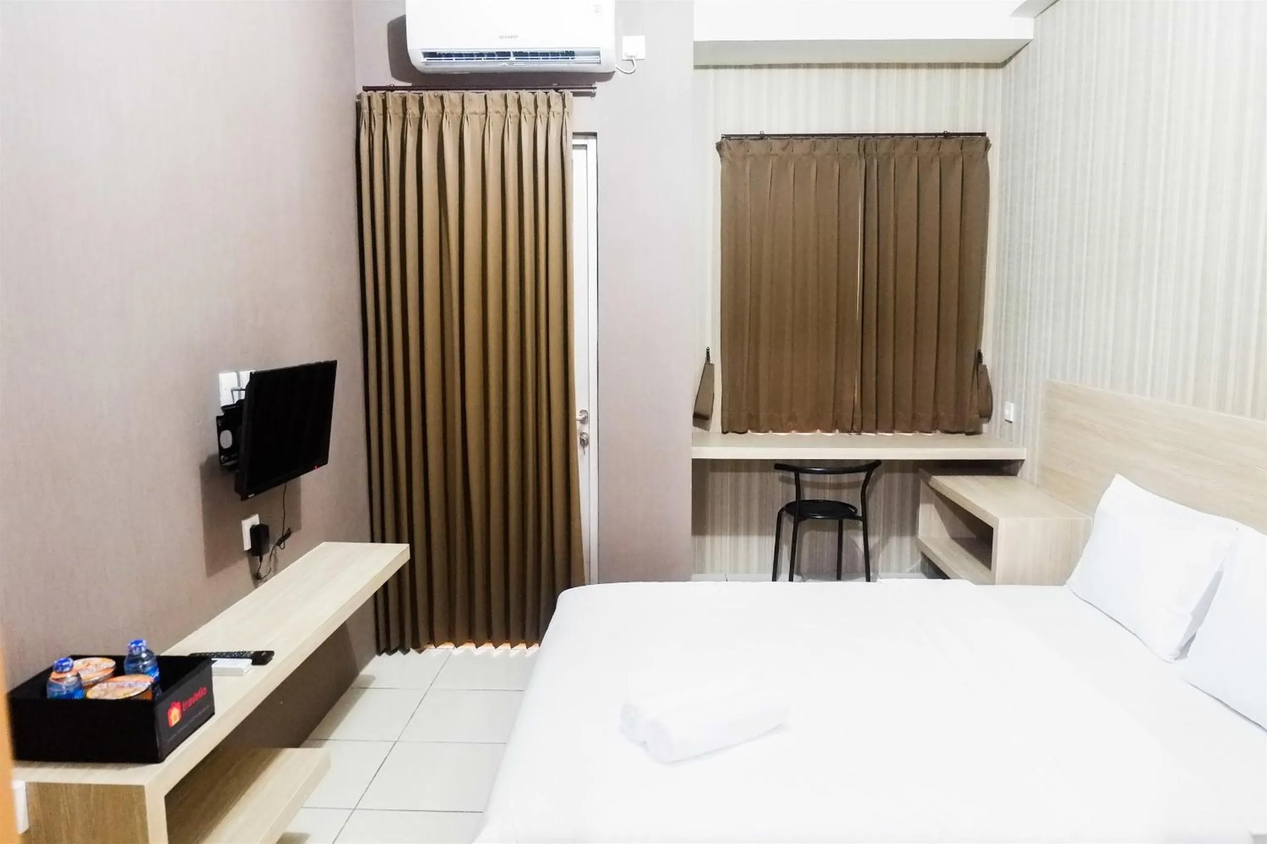 Bed in Modern Studio Apartment at Pavilion Permata 2 By Travelio