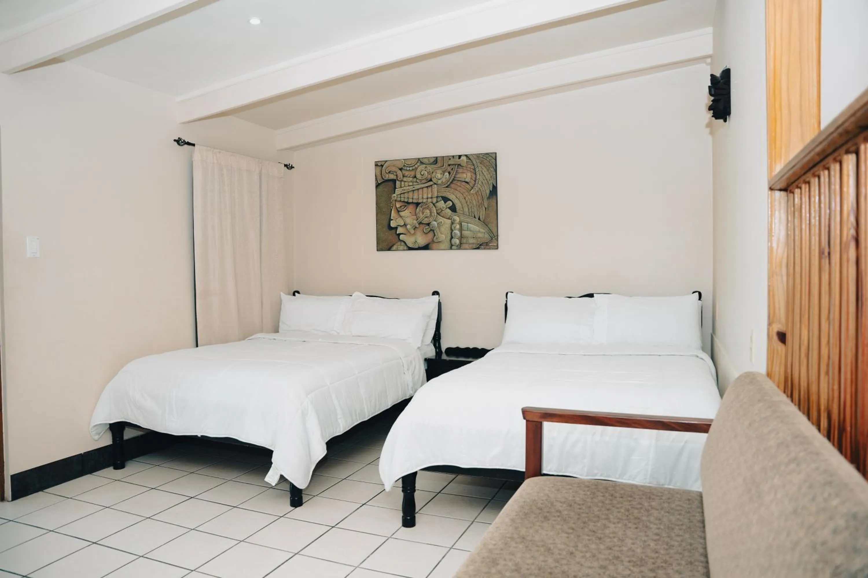 Bed in Rumors Resort Hotel