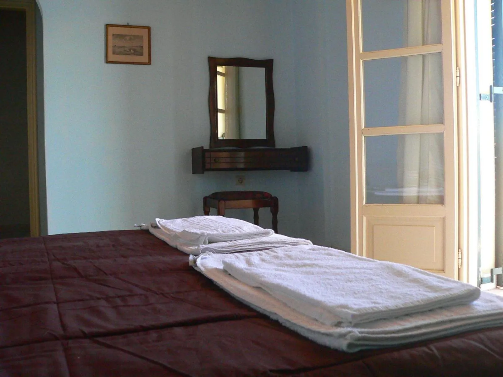 Bed in APRAOS BAY HOTEL