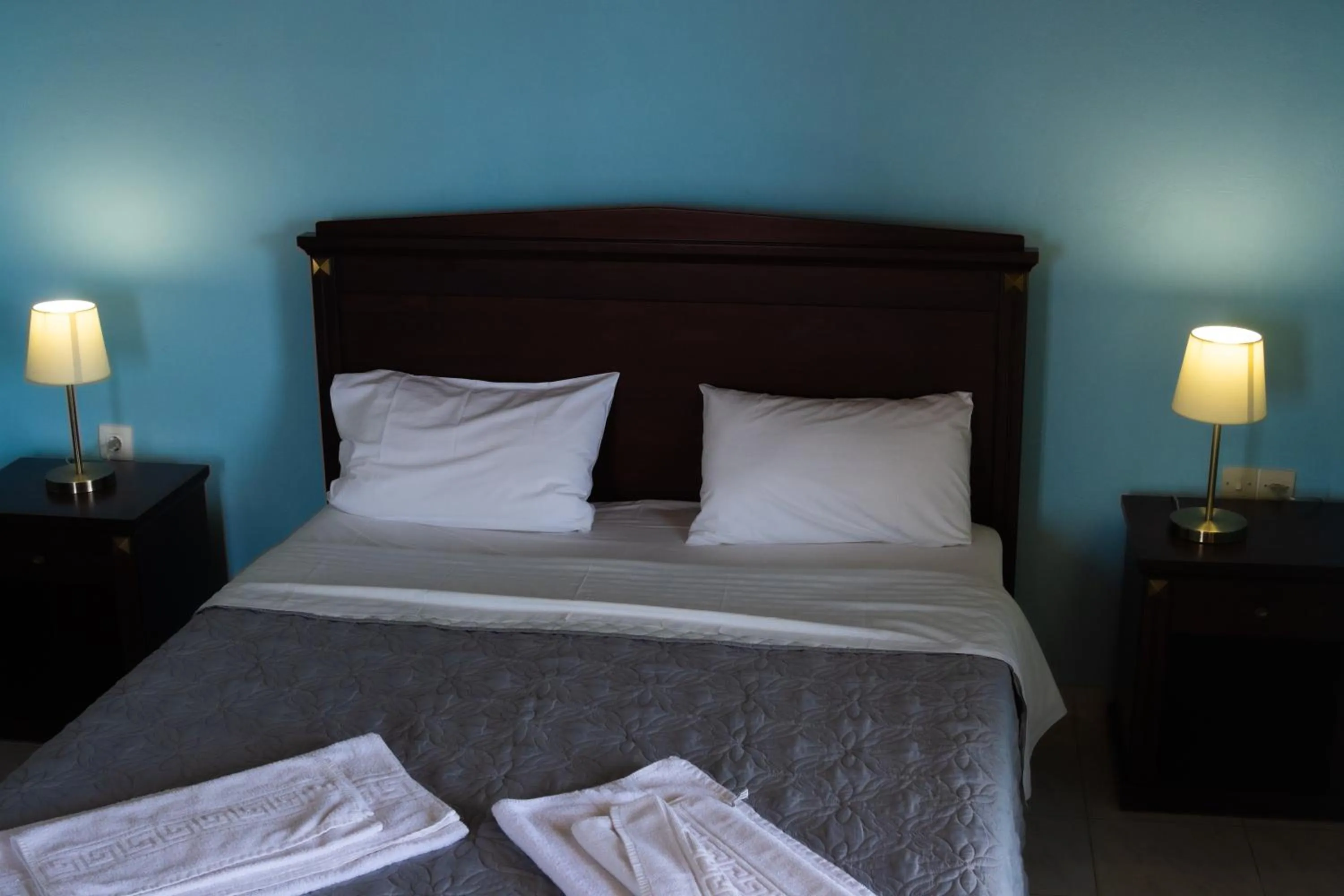 Bed in APRAOS BAY HOTEL