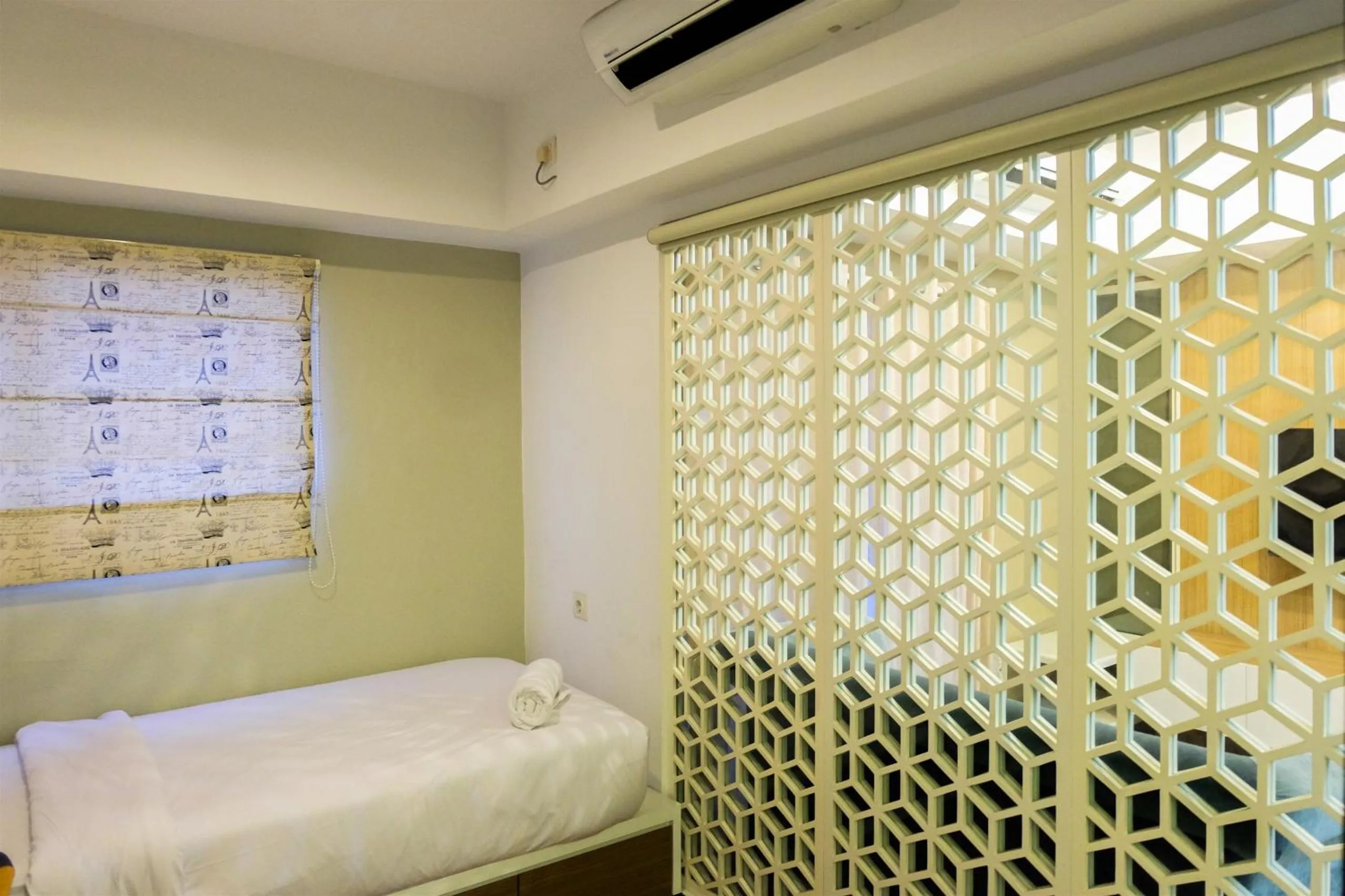 Bed in Amazing 2BR with City View The Wave Kuningan Apartment By Travelio