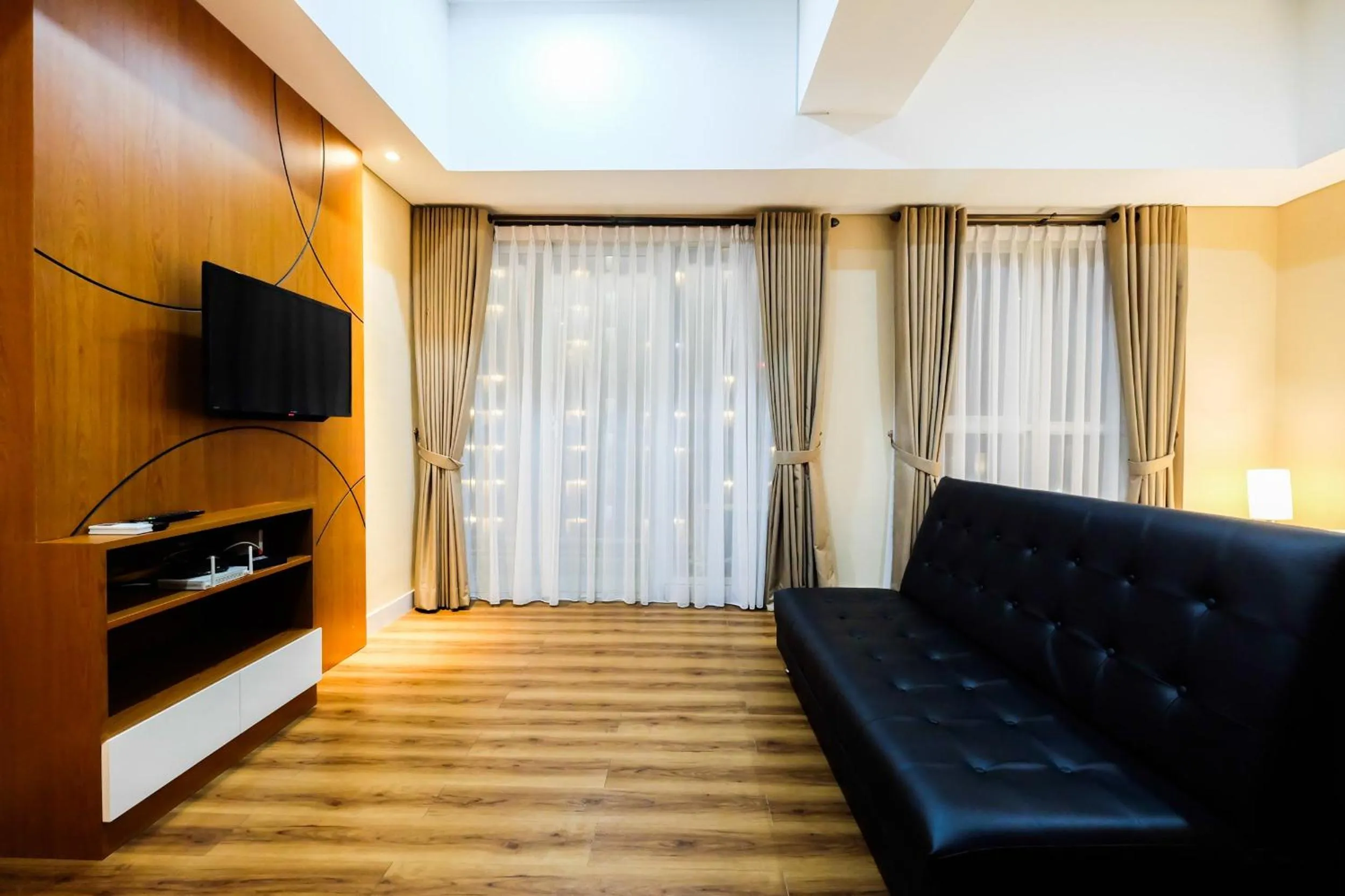 Living room in Exclusive 1BR Casa De Parco Apartment near AEON Mall By Travelio