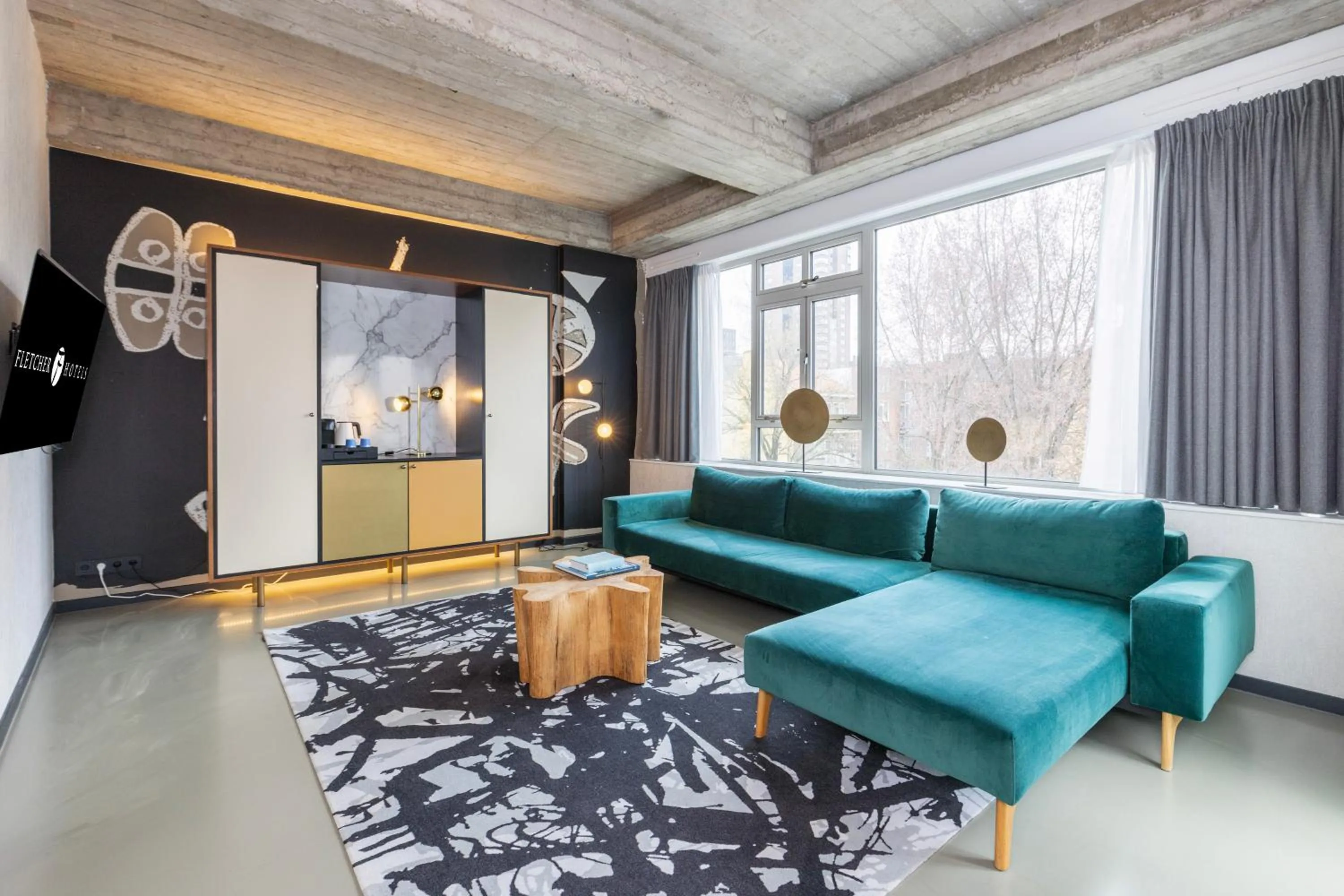 Communal lounge/ TV room in Fletcher Boutique Hotel Slaak-Rotterdam