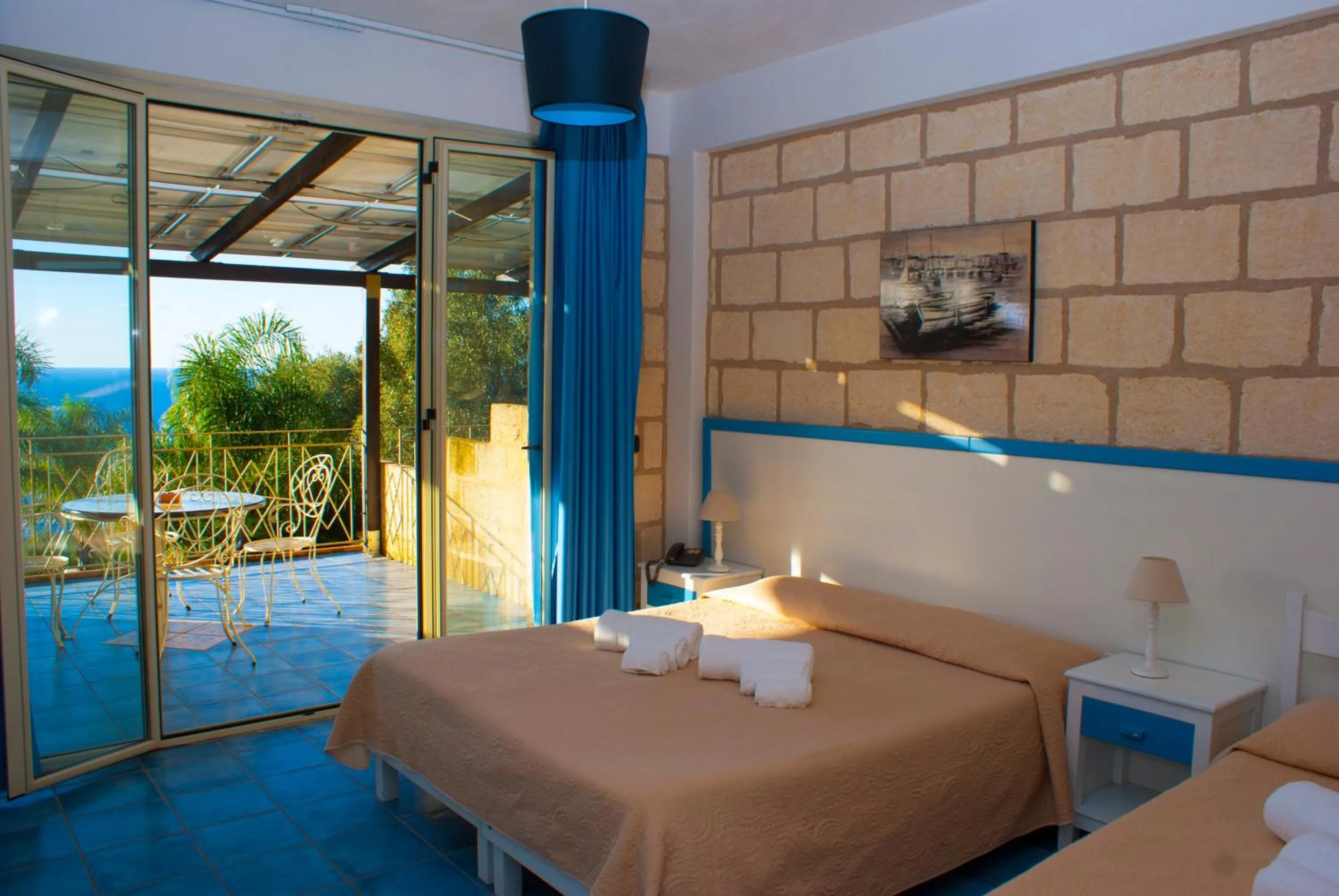Photo of the whole room, Bed in CapoSperone Resort