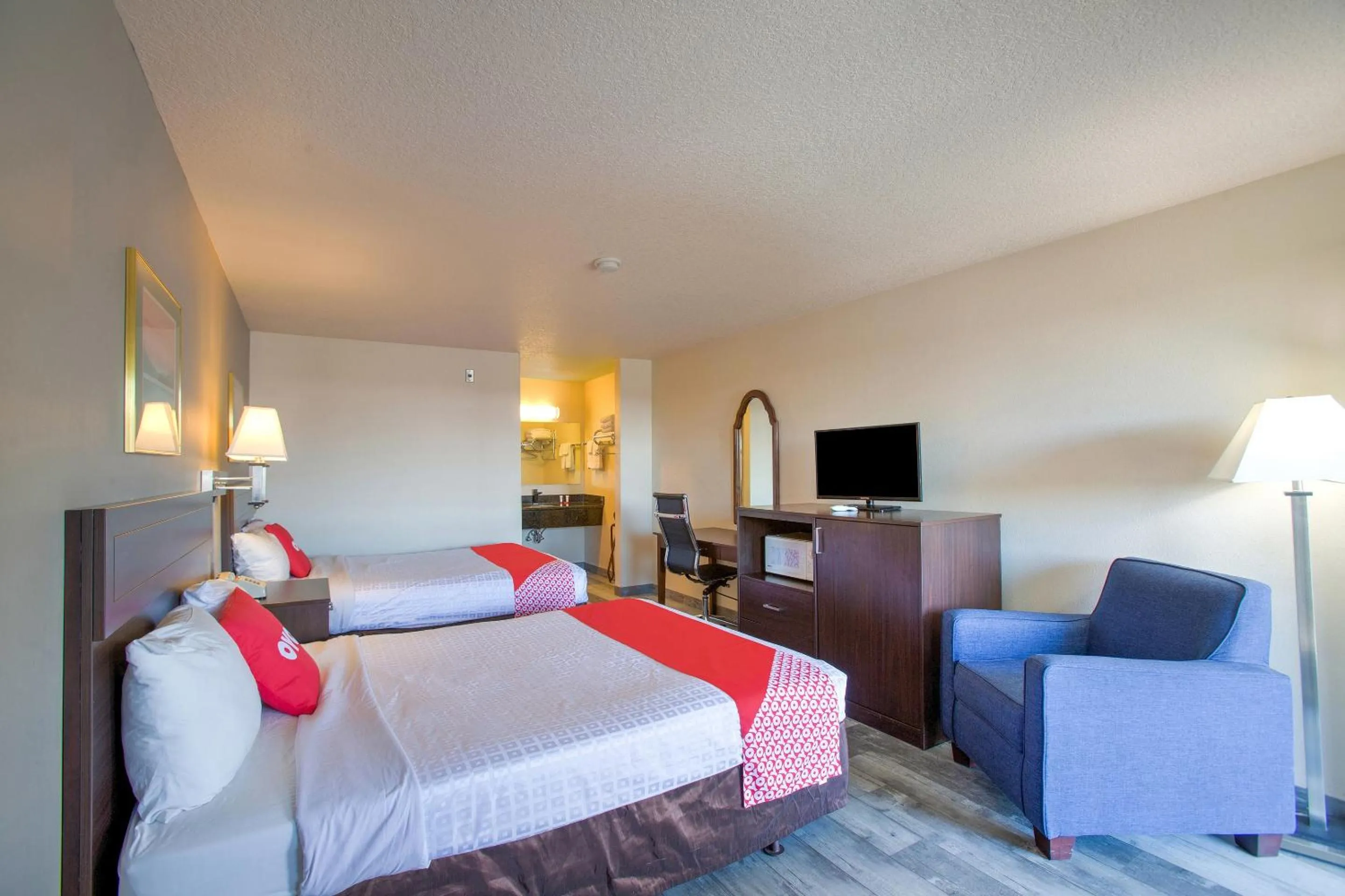 Bedroom, Bed in OYO Woodland Hotel and Suites