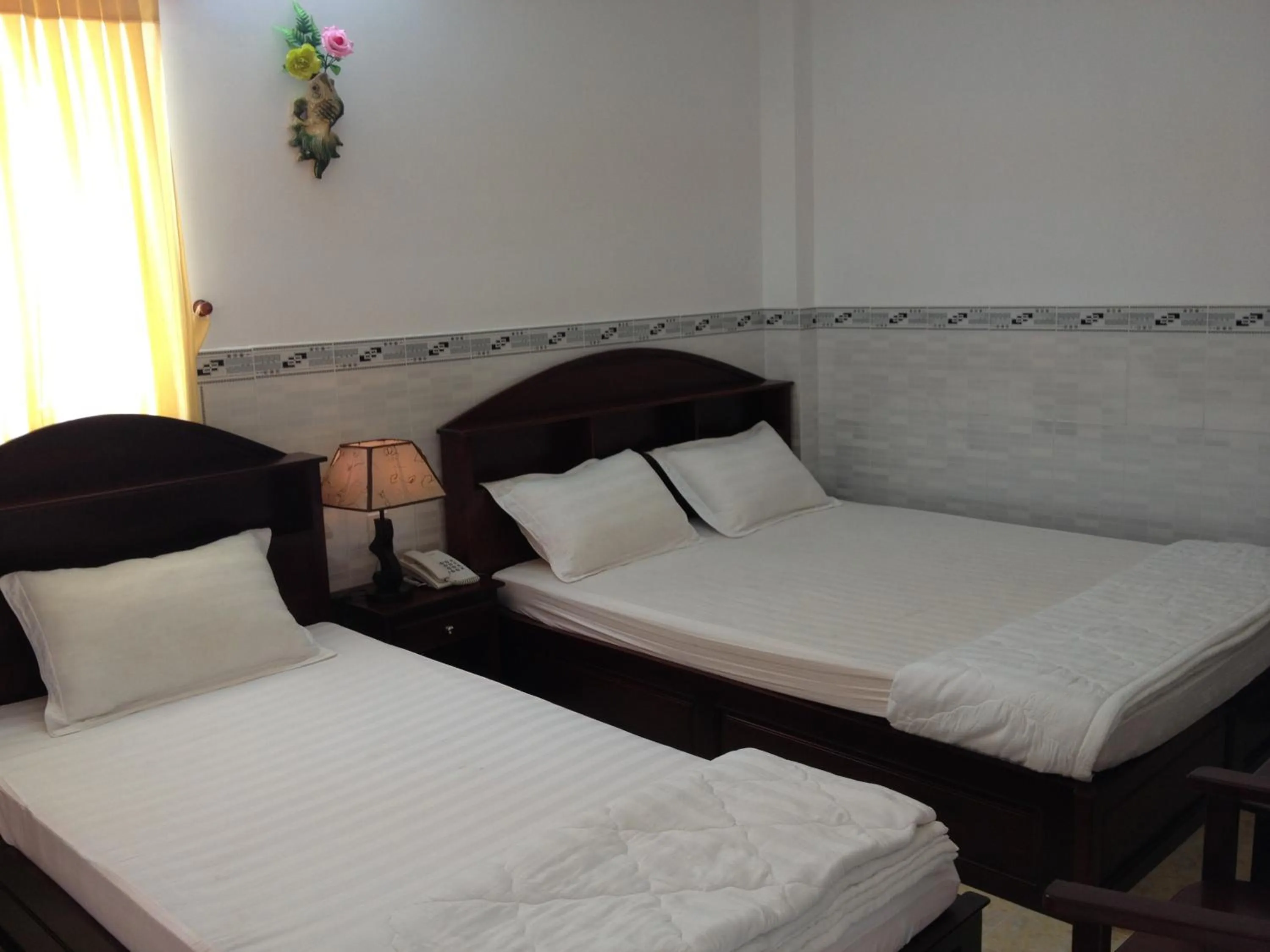 Photo of the whole room, Bed in Huynh Lac Can Tho Hotel