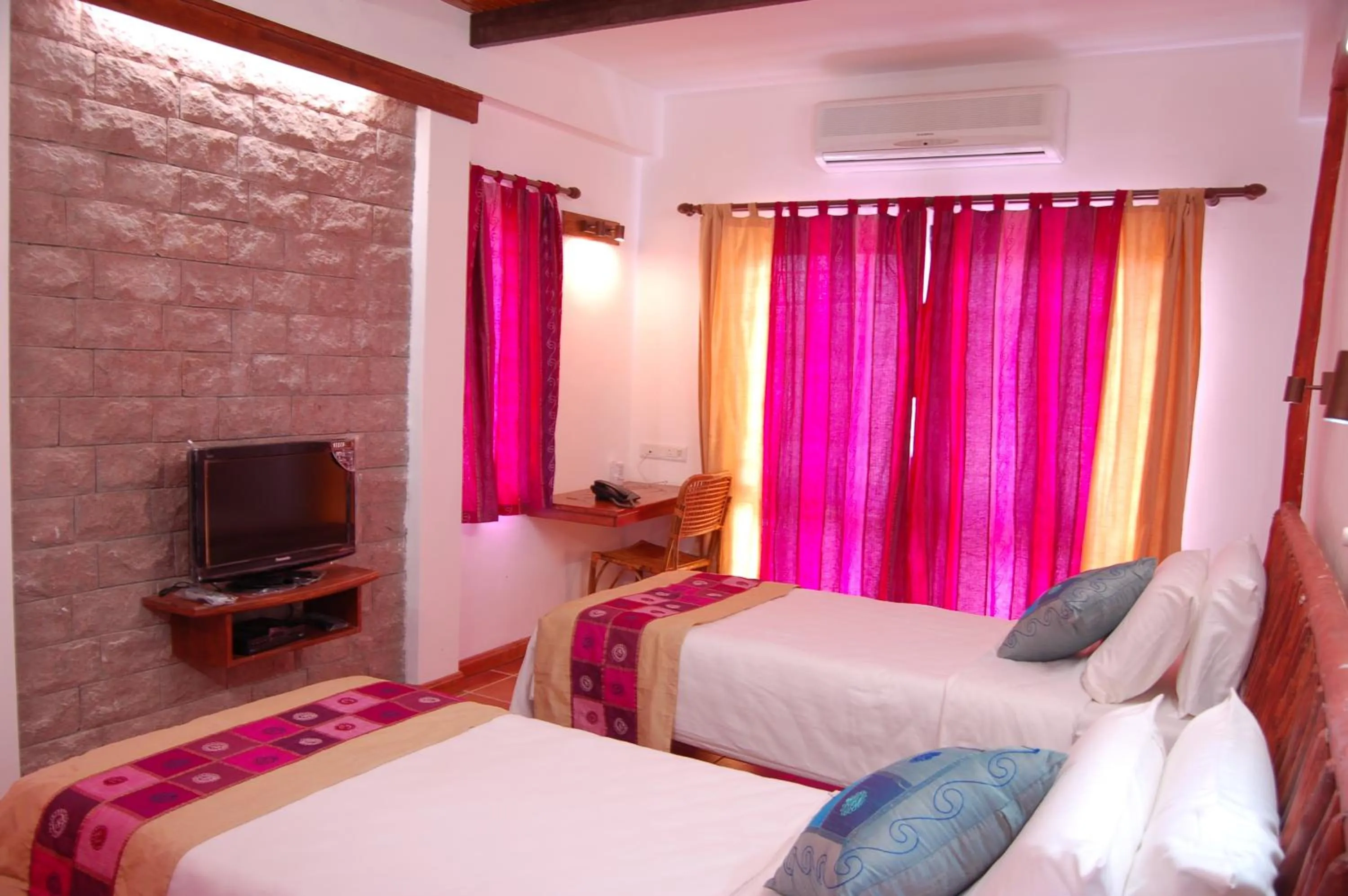 Bedroom in Kadambavanam Ethnic Village Resort