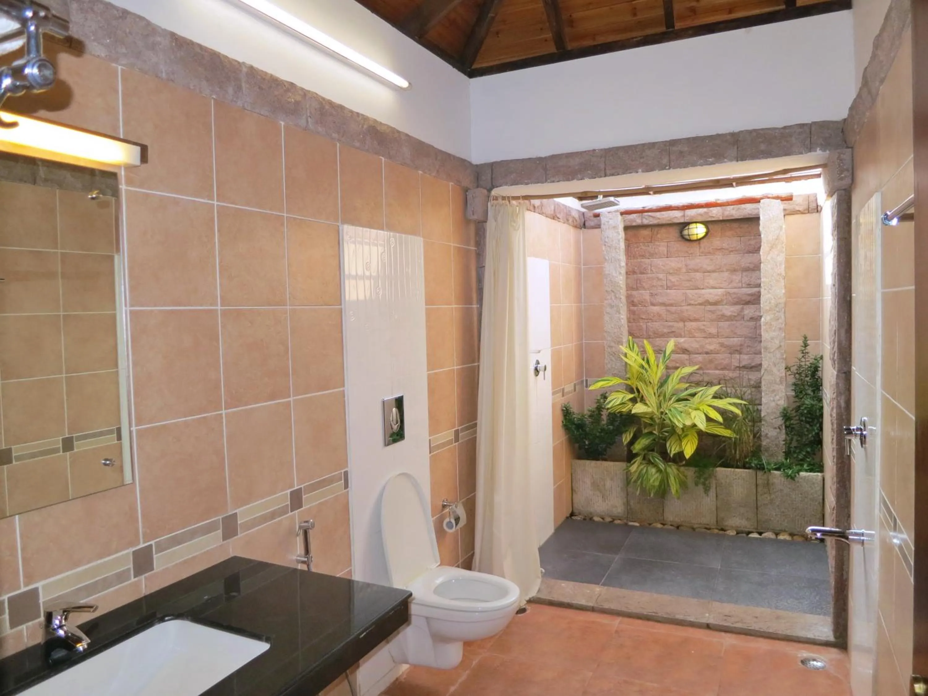 Bathroom in Kadambavanam Ethnic Village Resort
