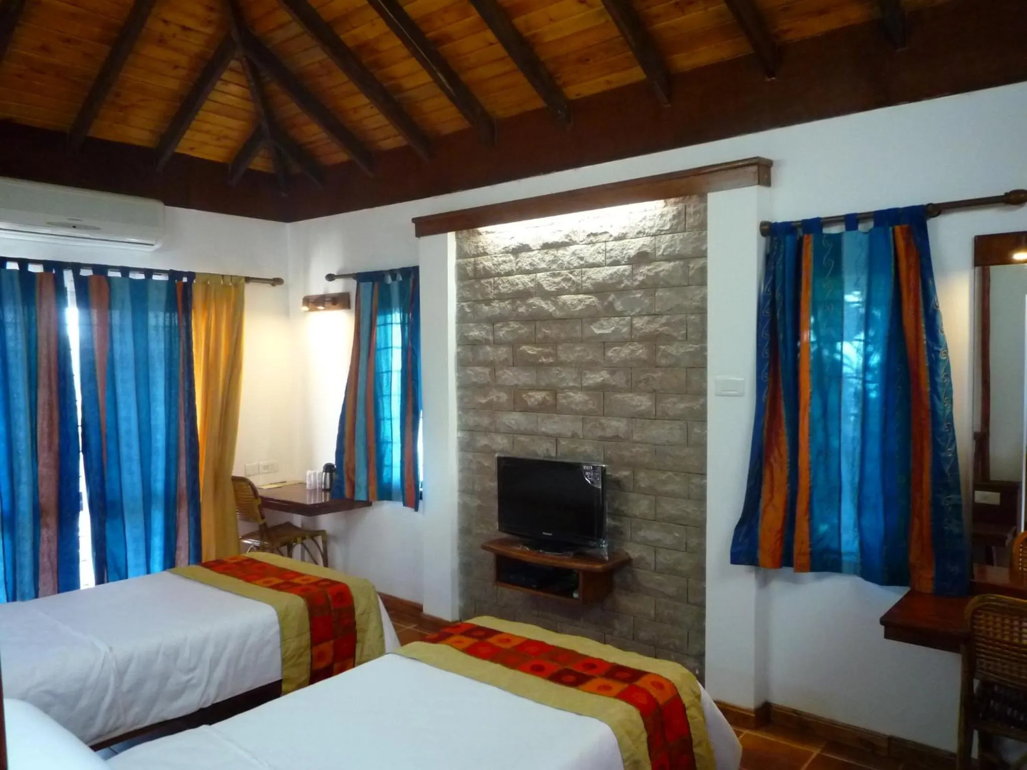 Bedroom in Kadambavanam Ethnic Village Resort