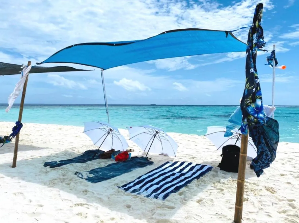 By the shade Maldives