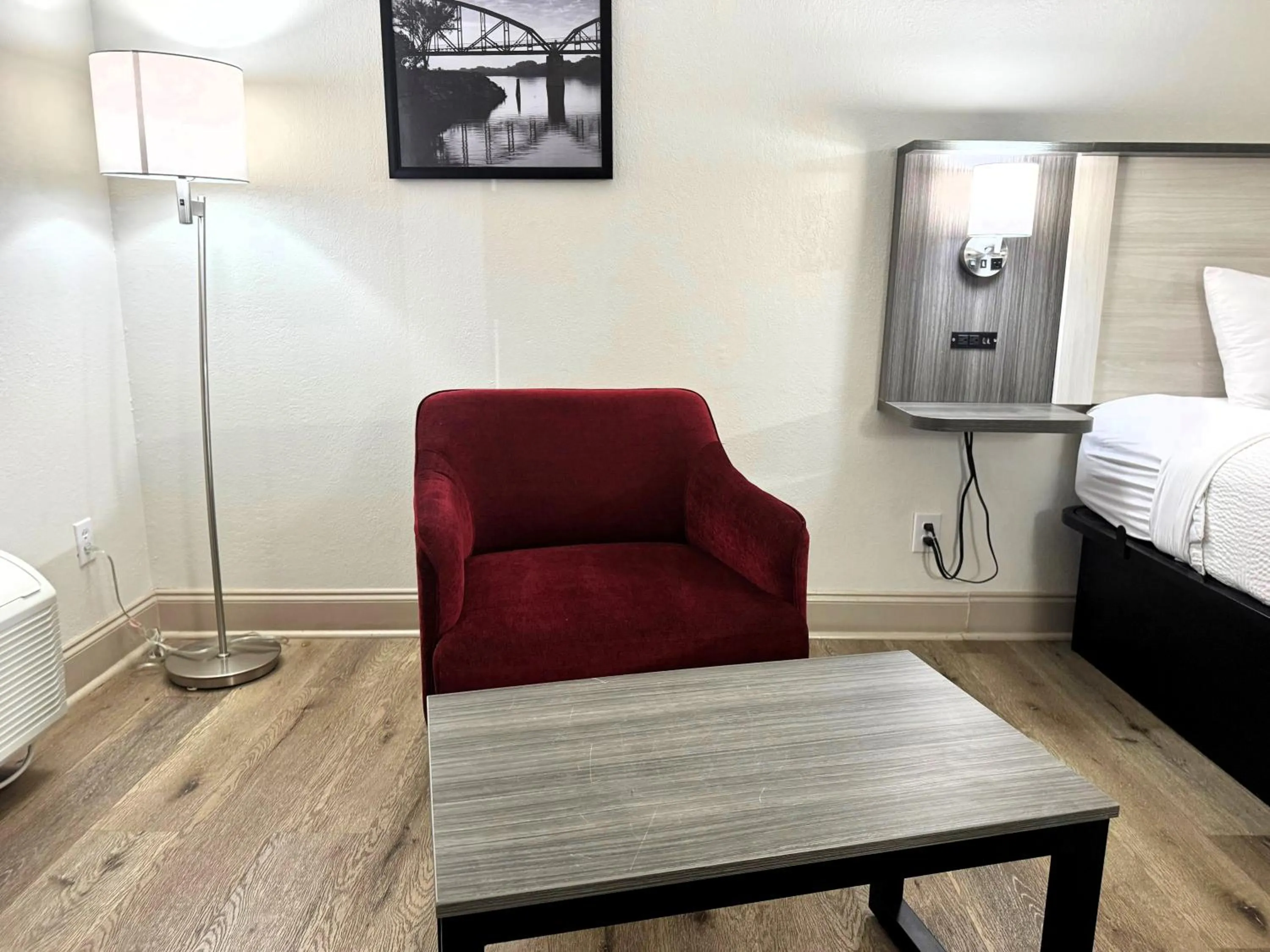 Seating area, Bed in Ramada by Wyndham Pelham