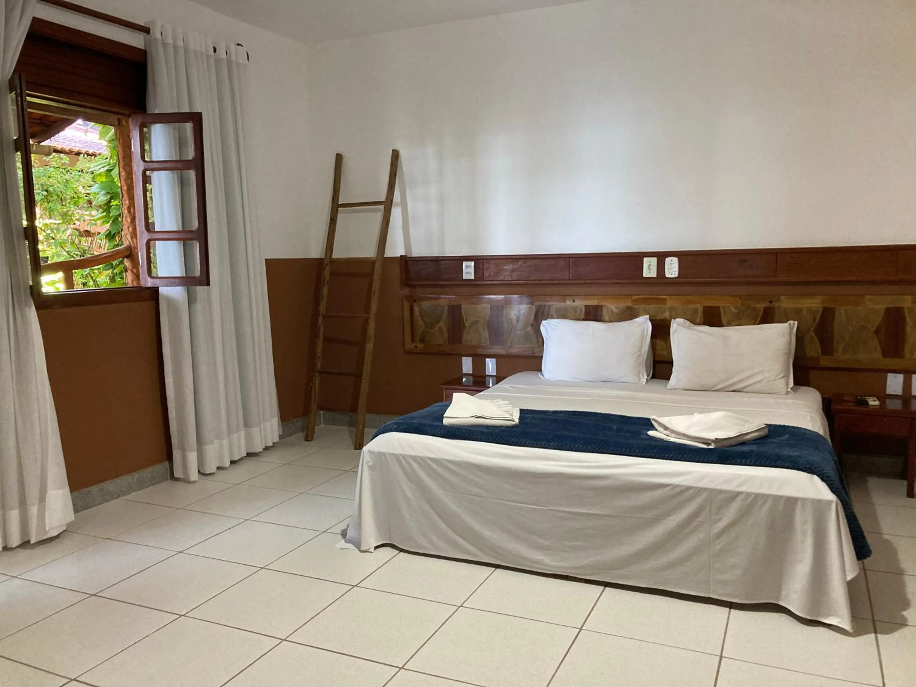 Bed in Pousada Pau Brasil Ubu