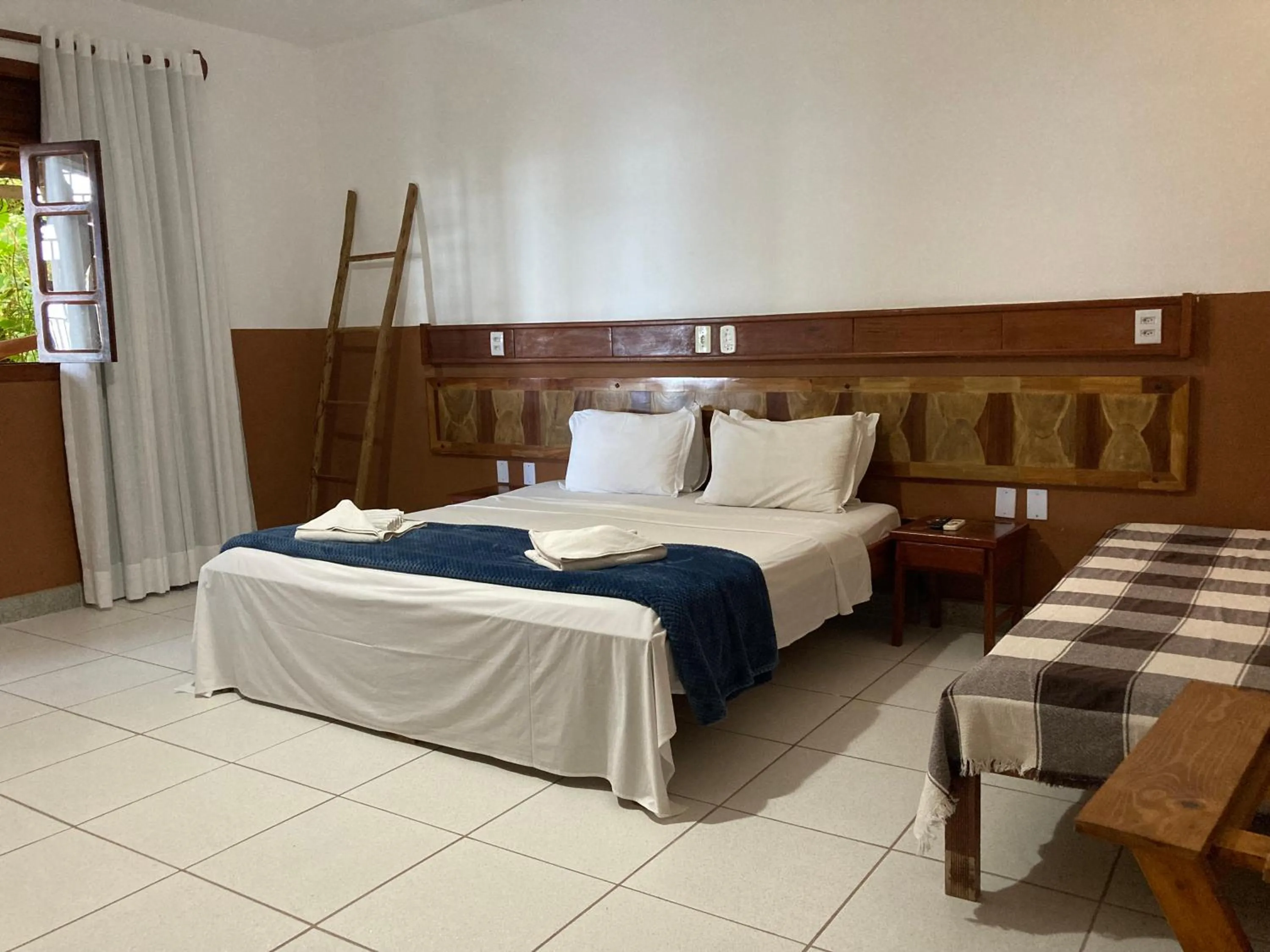 Bed in Pousada Pau Brasil Ubu