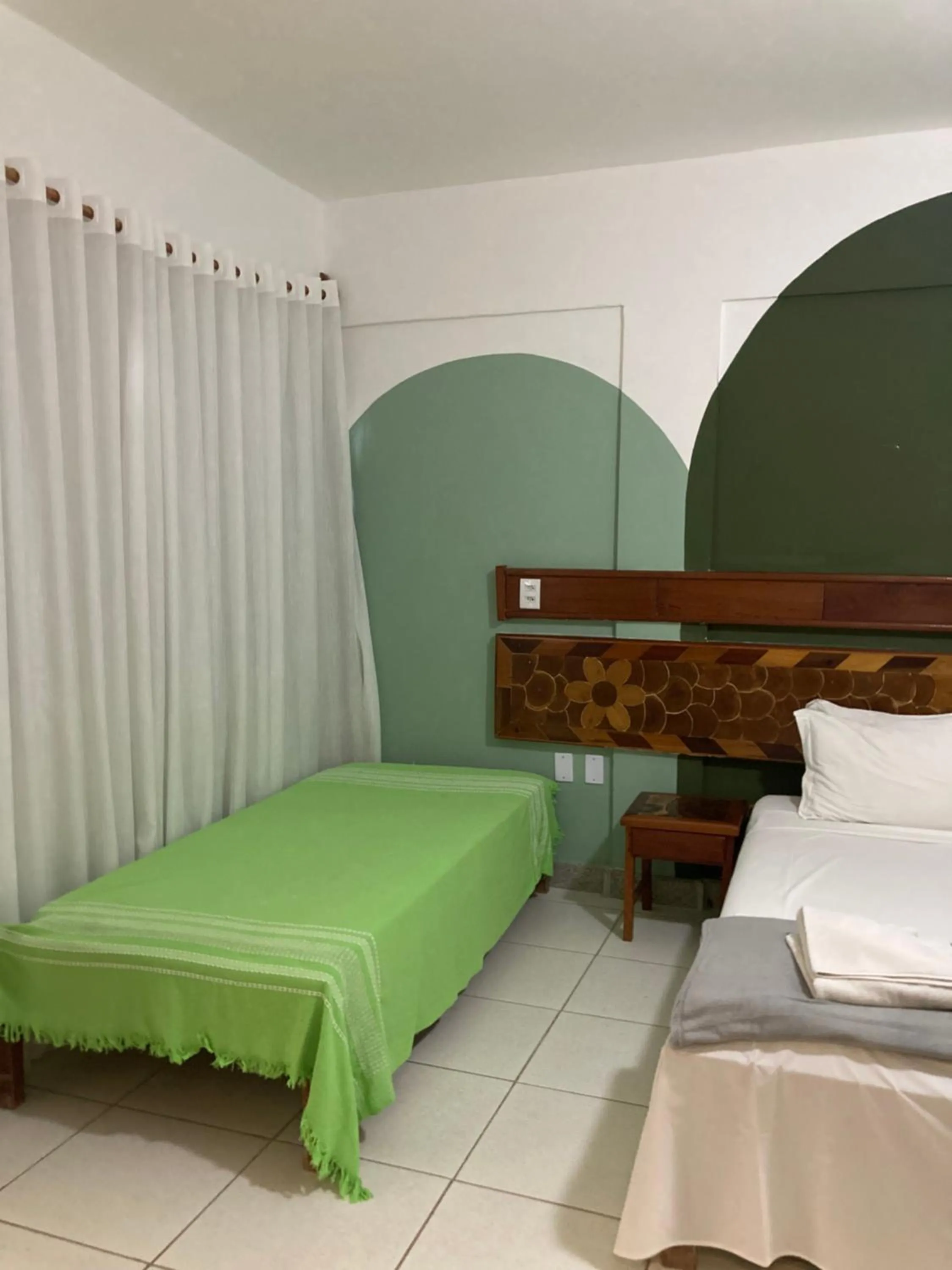 Bed in Pousada Pau Brasil Ubu