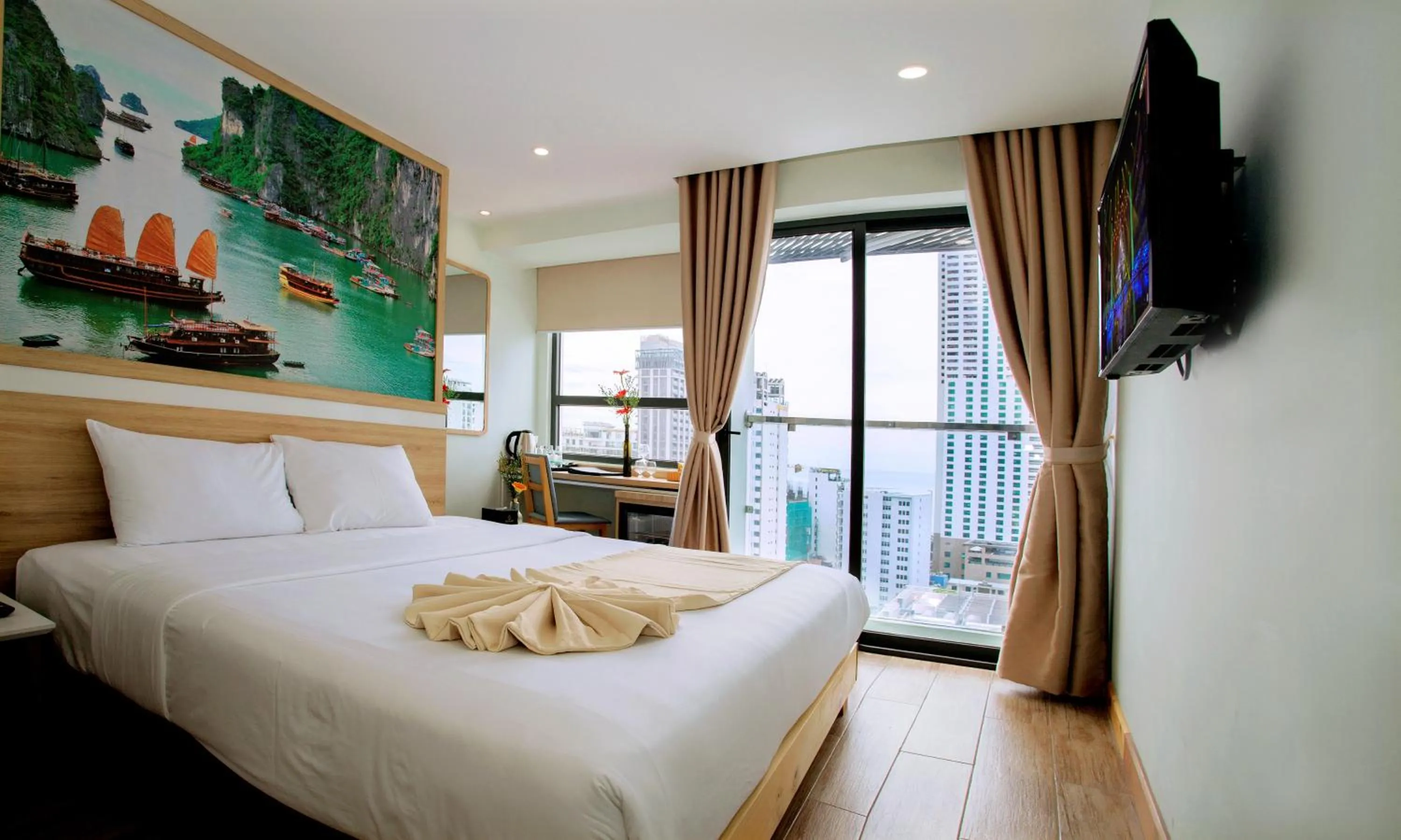 Bed in Royal HPM Hotel